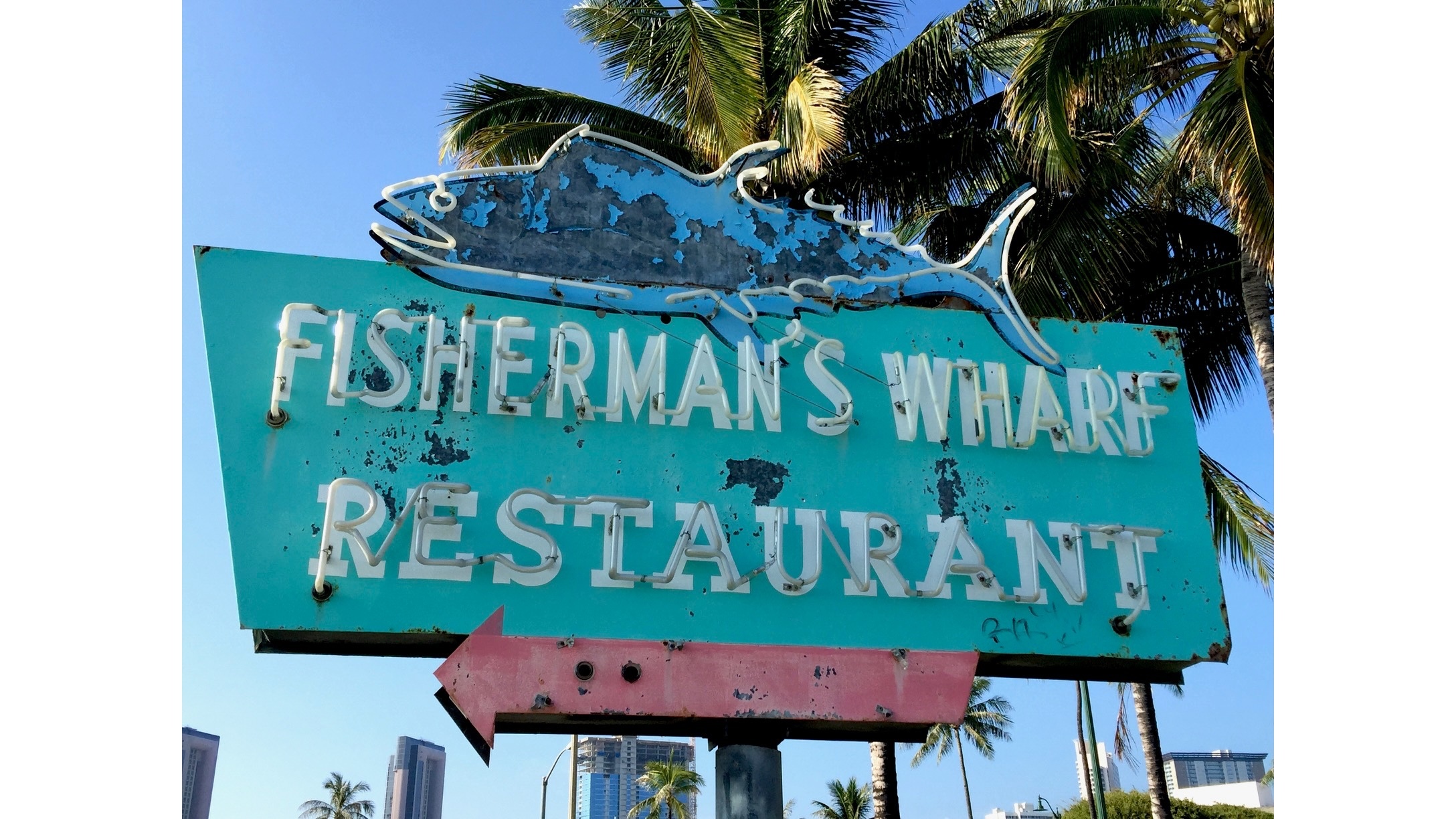 Tattered sign for Fisherman's Wharf after restaurant itself was long gone