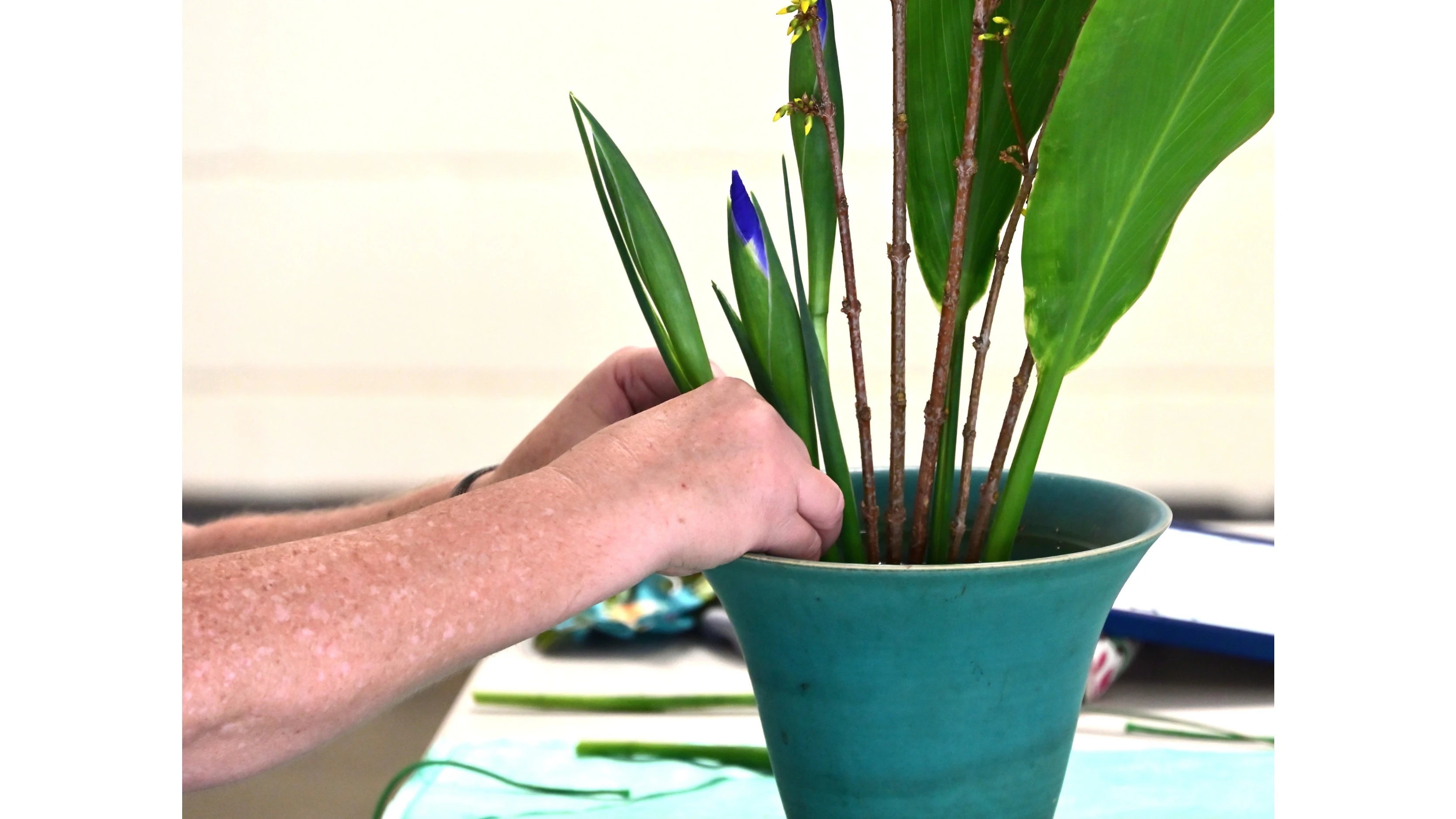 Each element in an ikebana arrangement is placed with precision, as Tinius demonstrates.