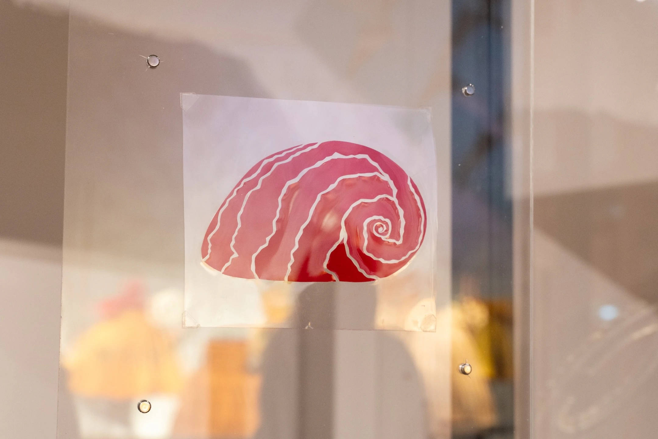 Rubylith artwork, like this design featuring a sea snail, are on display at the exhibit.
