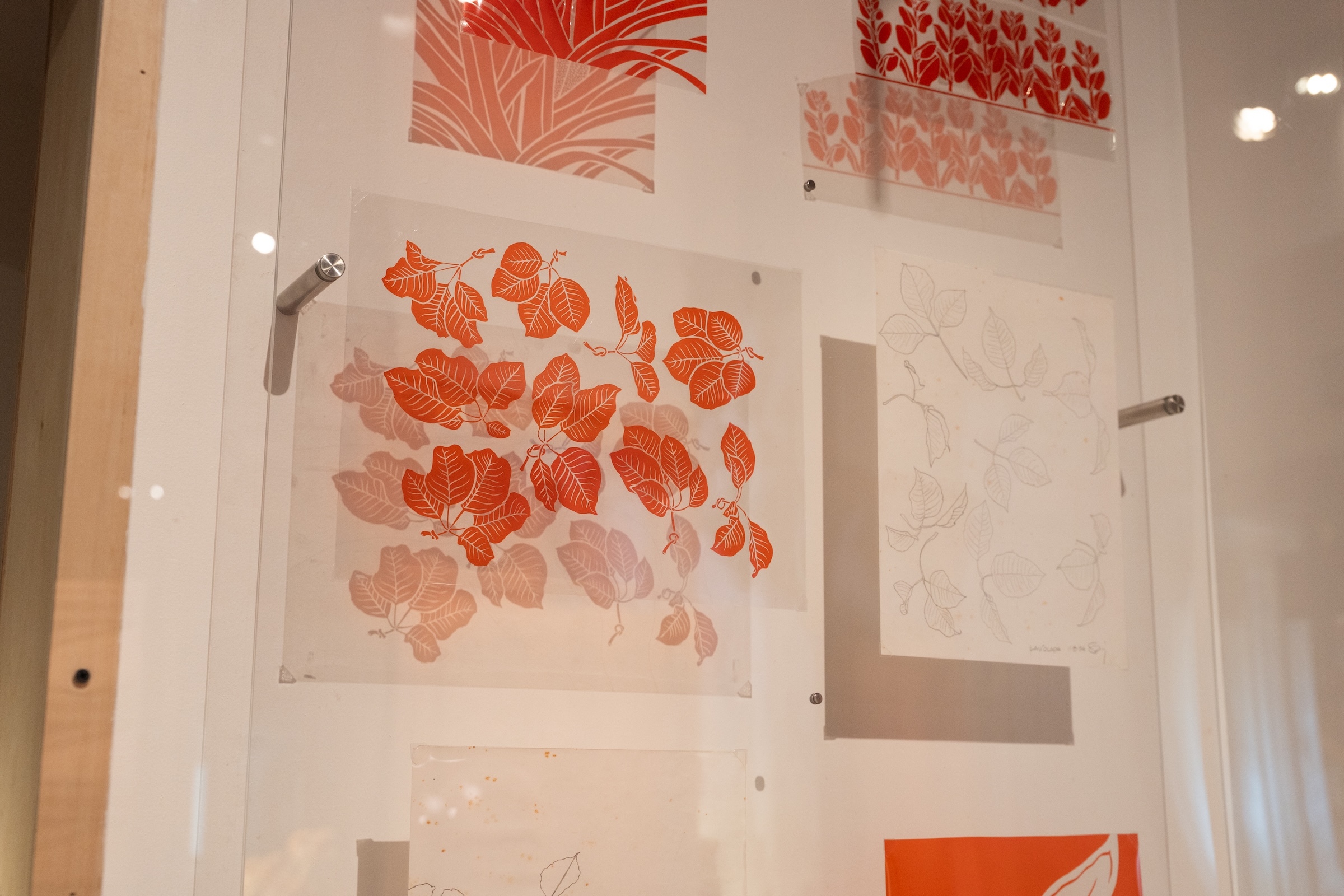 The exhibit features new and archival sketches and rubylith artworks by Sig Zane from 1990 to present.