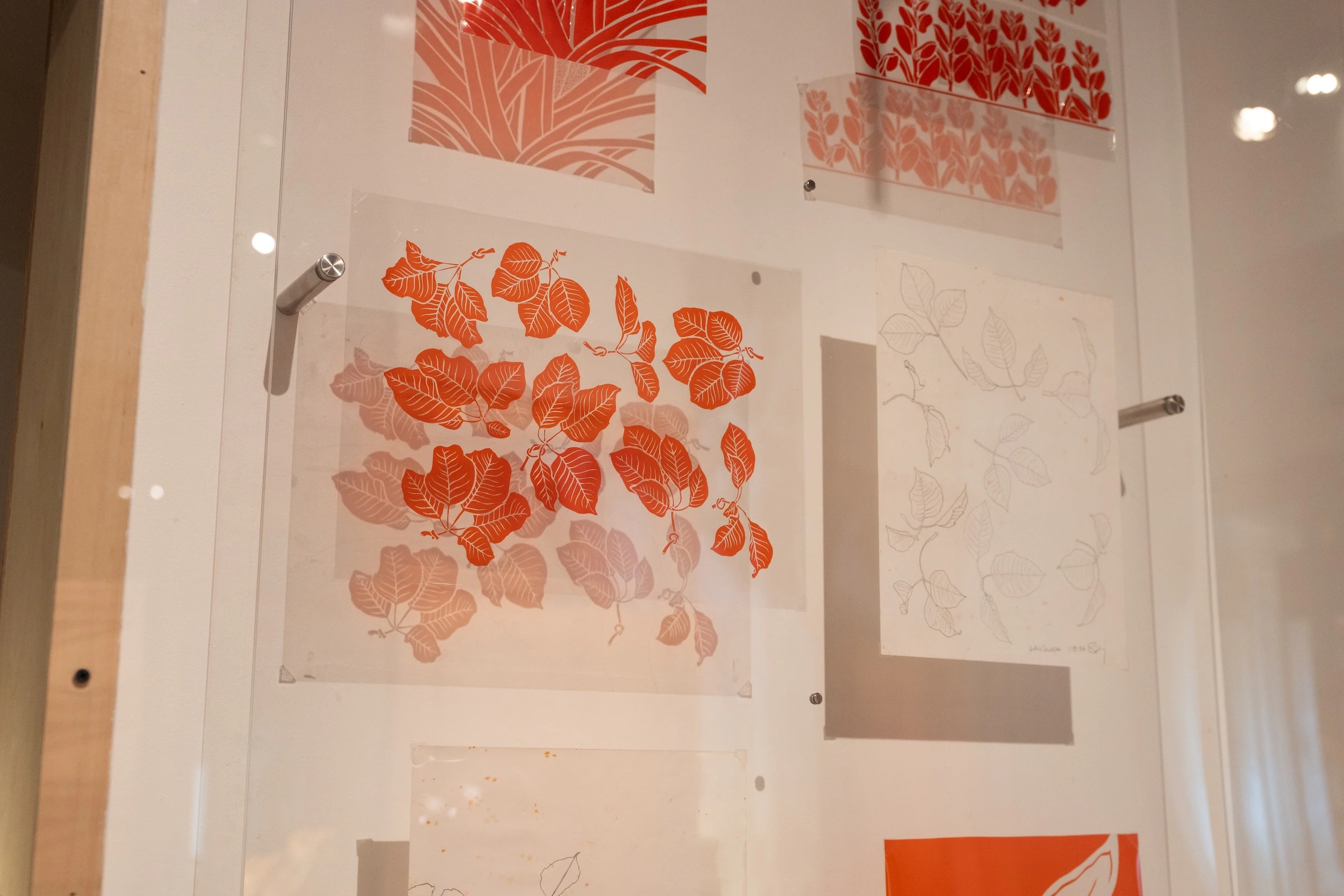 The exhibit features new and archival sketches and rubylith artworks by Sig Zane from 1990 to present.