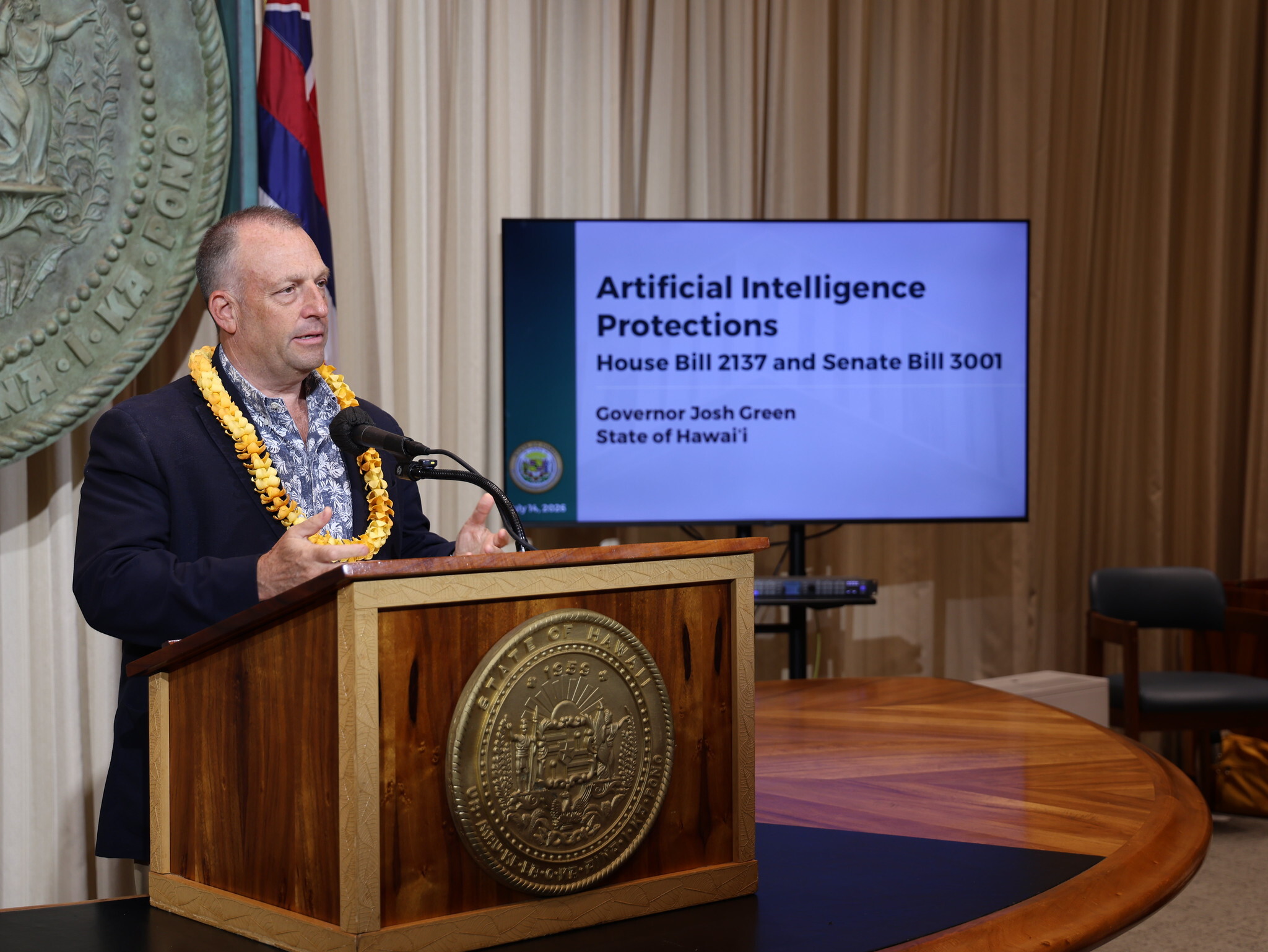 Gov. Josh Green presents two new AI regulation laws on Tuesday.