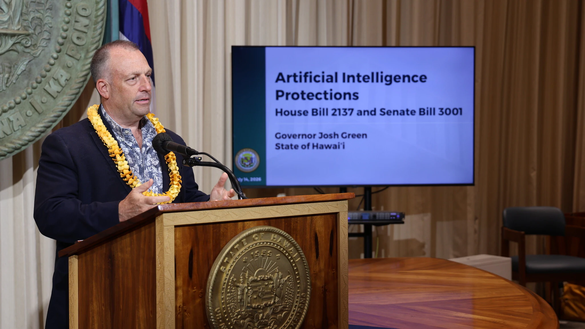 Gov. Josh Green presents two new AI regulation laws on Tuesday.
