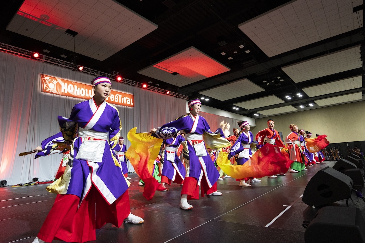 Performance groups participated in a mini parade at the Hawaiʻi Convention Center on Sunday, March 15. The event was not open to the public and the audience included other performers.