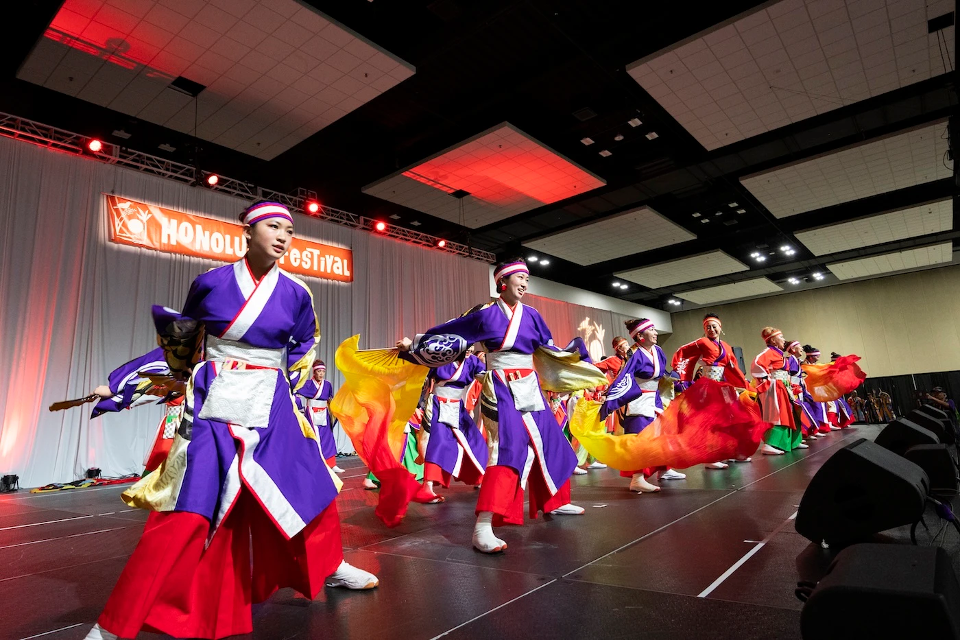 Performance groups participated in a mini parade at the Hawaiʻi Convention Center on Sunday, March 15. The event was not open to the public and the audience included other performers.