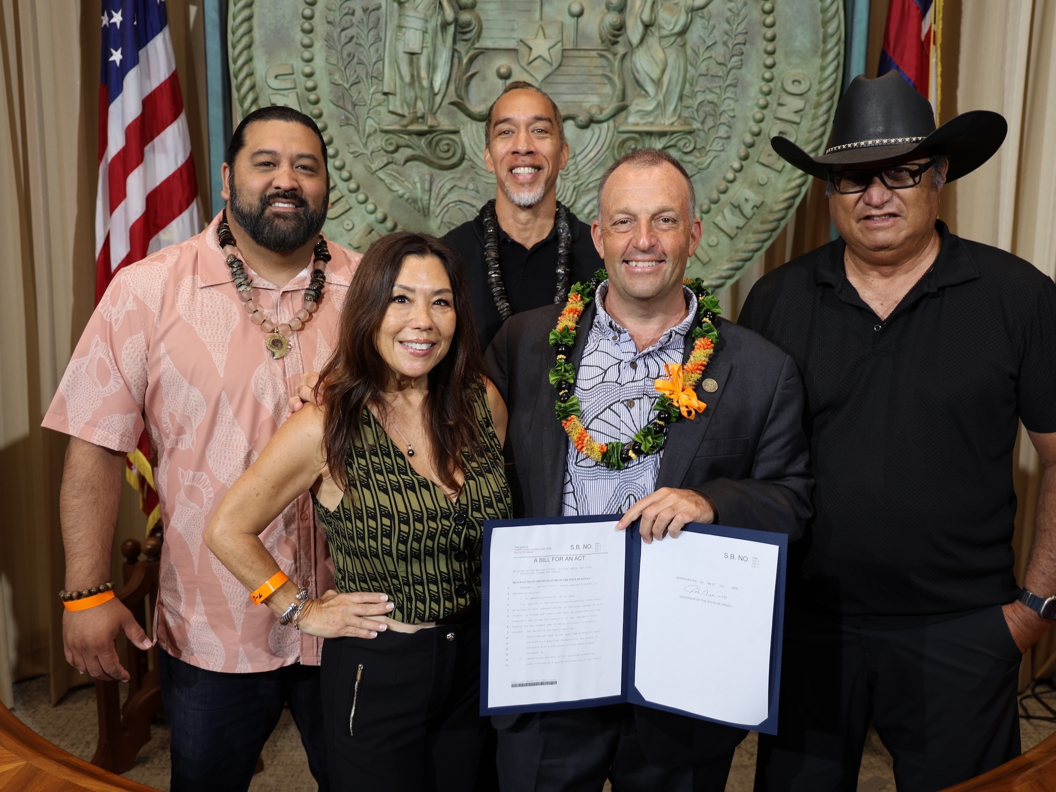 From left to right, front row:  Producer Angie Laprete and Gov. Josh Green. Back row:  Screenwriter Thomas Paʻa Sibbett, Actor Moses Goods and Producer Brian Keaulana.