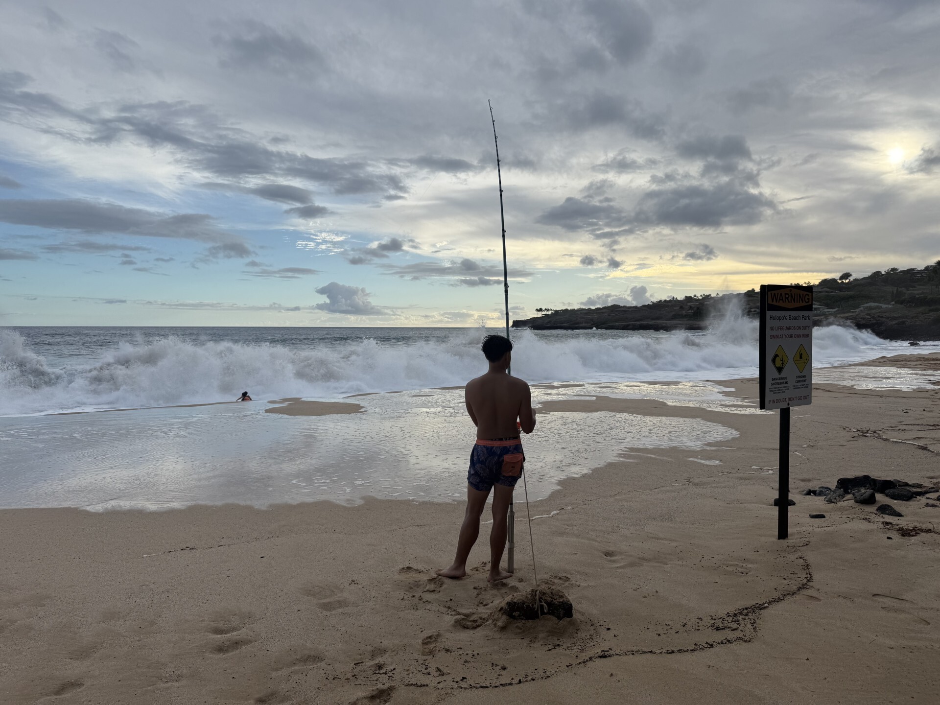 fishing in high surf on Lanai