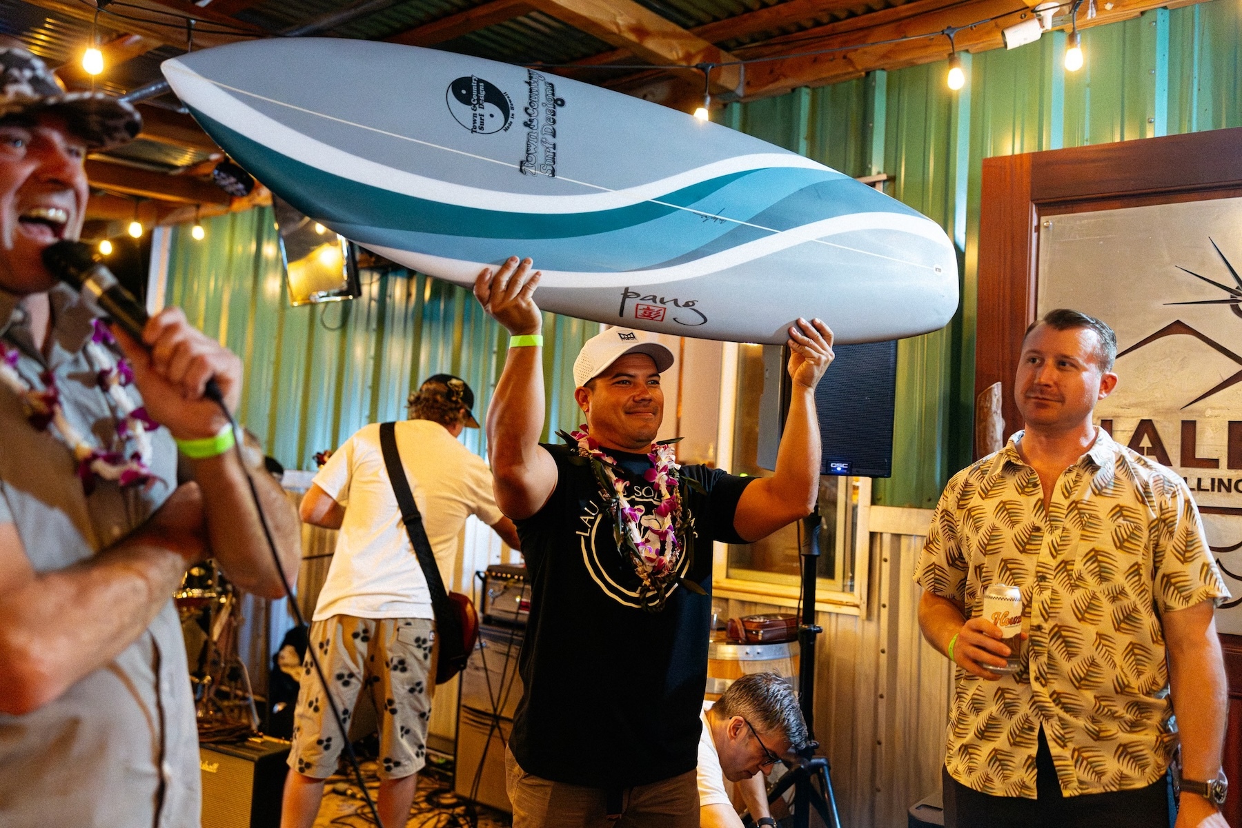 Joey Cadiz, center, at the premiere of “Hometown Hype: Haleʻiwa – Surfing’s Final Boss.”