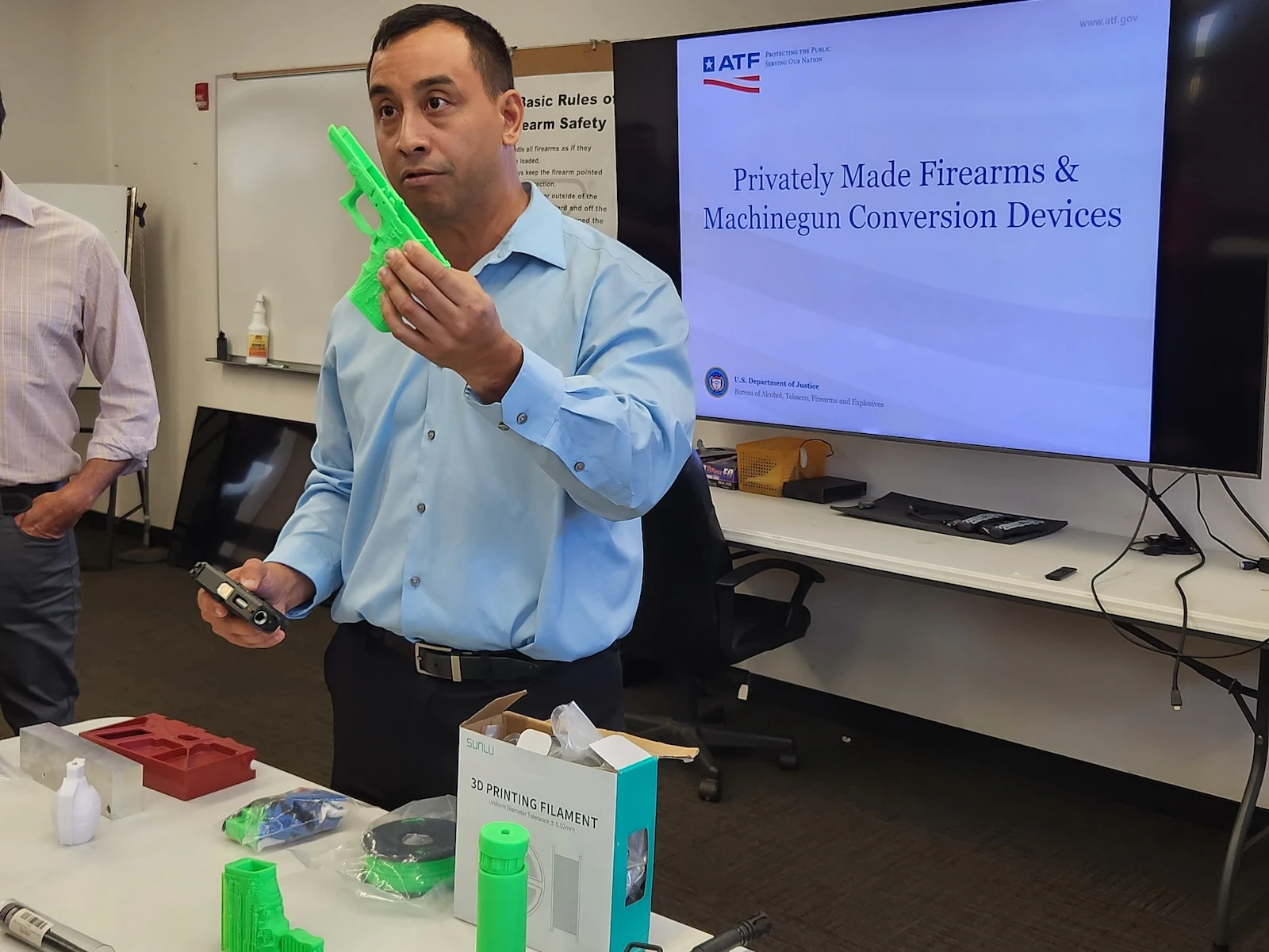 Mike Lambert holding a gun component