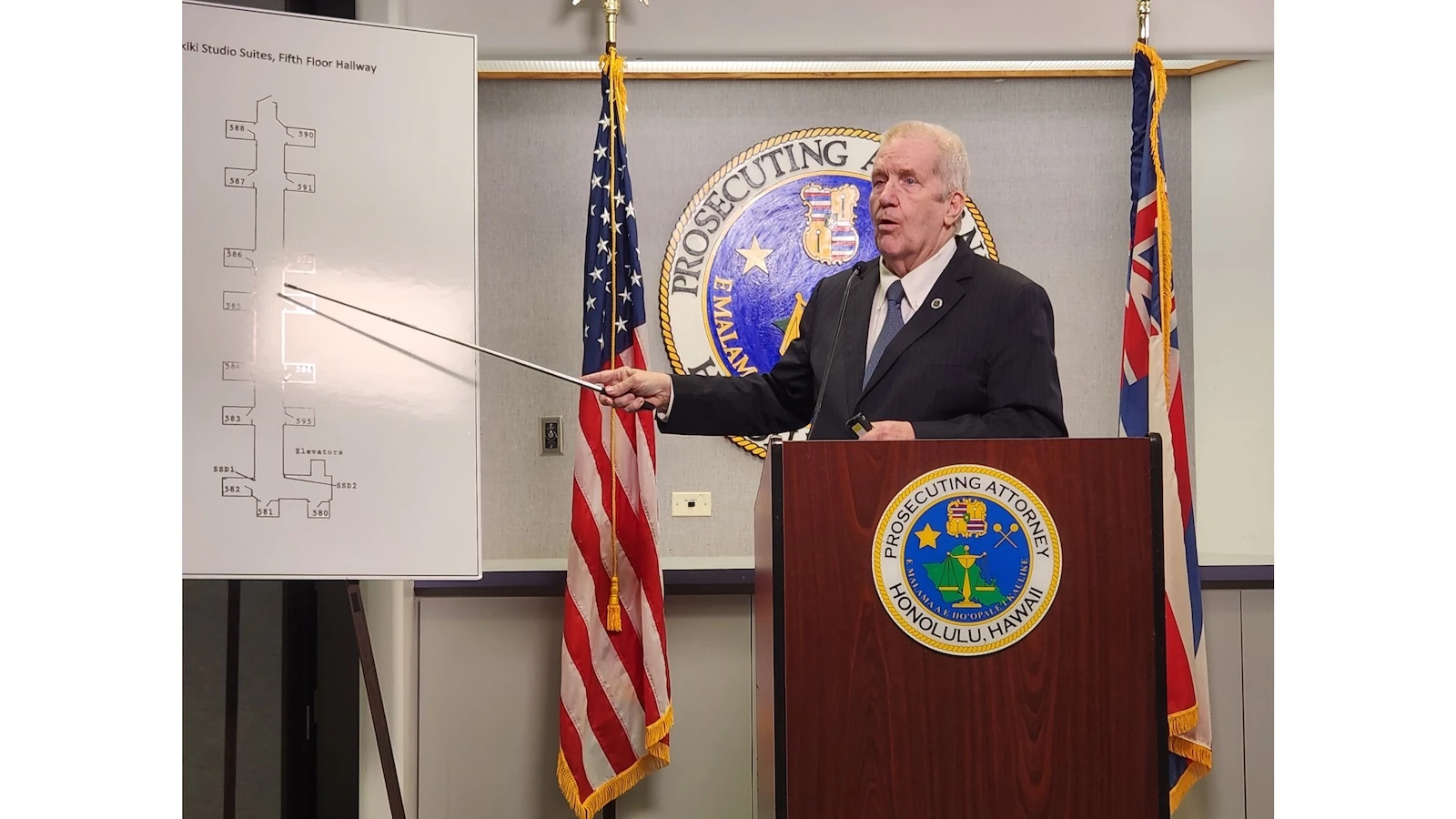 Steve Alm points at a whiteboard