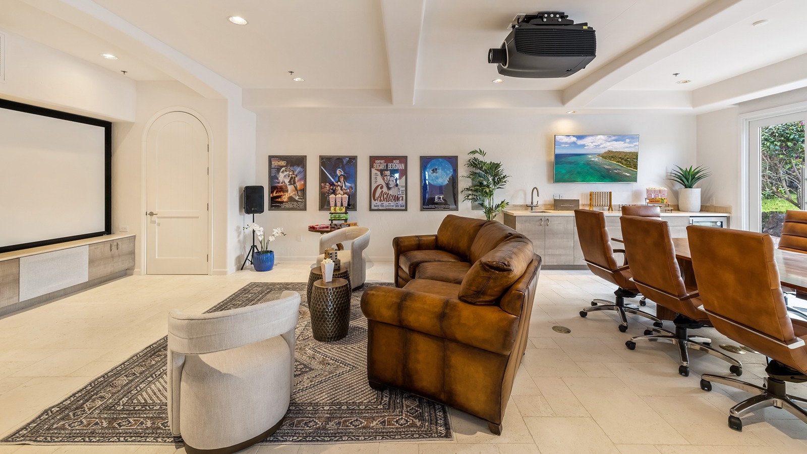 The home has a state-of-the-art media room with a 140-inch theater screen and built-in wet bar.