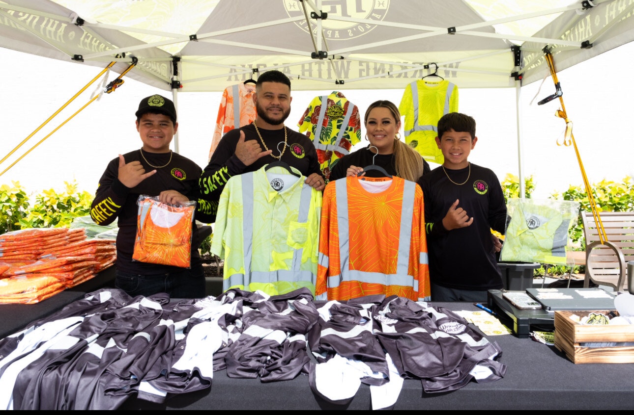 Shane and Corry Ahlo, the owners of Ahlo’s Apparel, pictured at a pop-up event with their two sons.