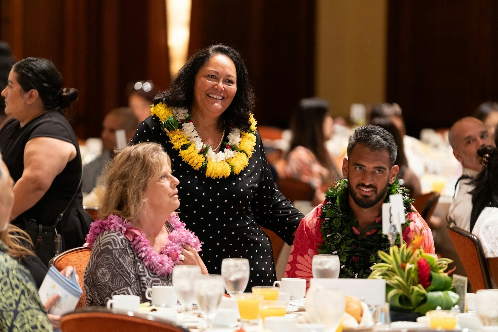 Boys & Girls Club of Hawaiʻi President and CEO Paddy Kauhane pictured at the 2025 luncheon, which recognized Ladayna Aranas, 2025 Youth of the Year. Marcus Mariota, right, spoke at the event.