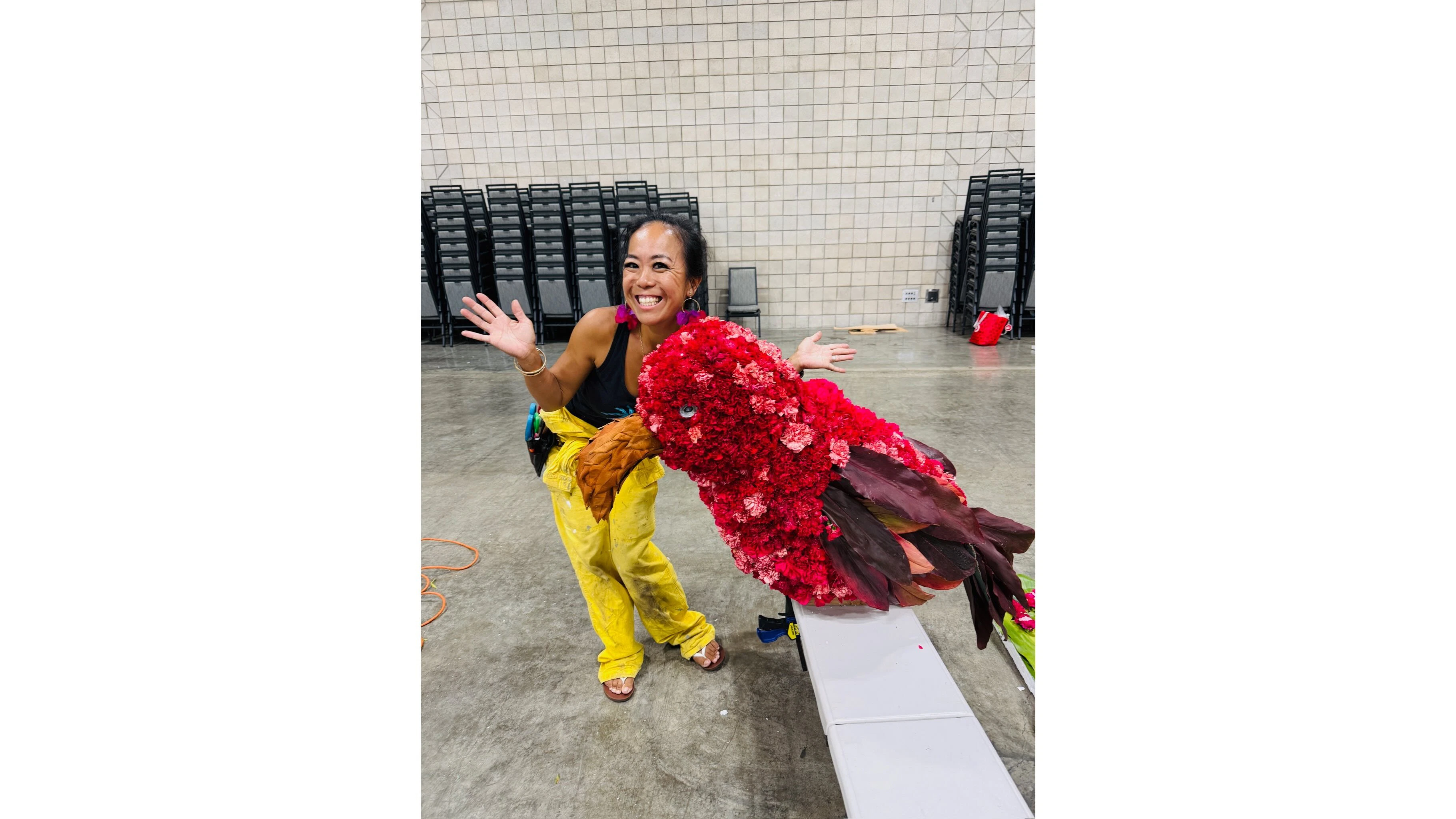 Ka‘imi Koehler displays the ‘i‘iwi that she made from fresh flowers and leaves for last year’s first-place float.