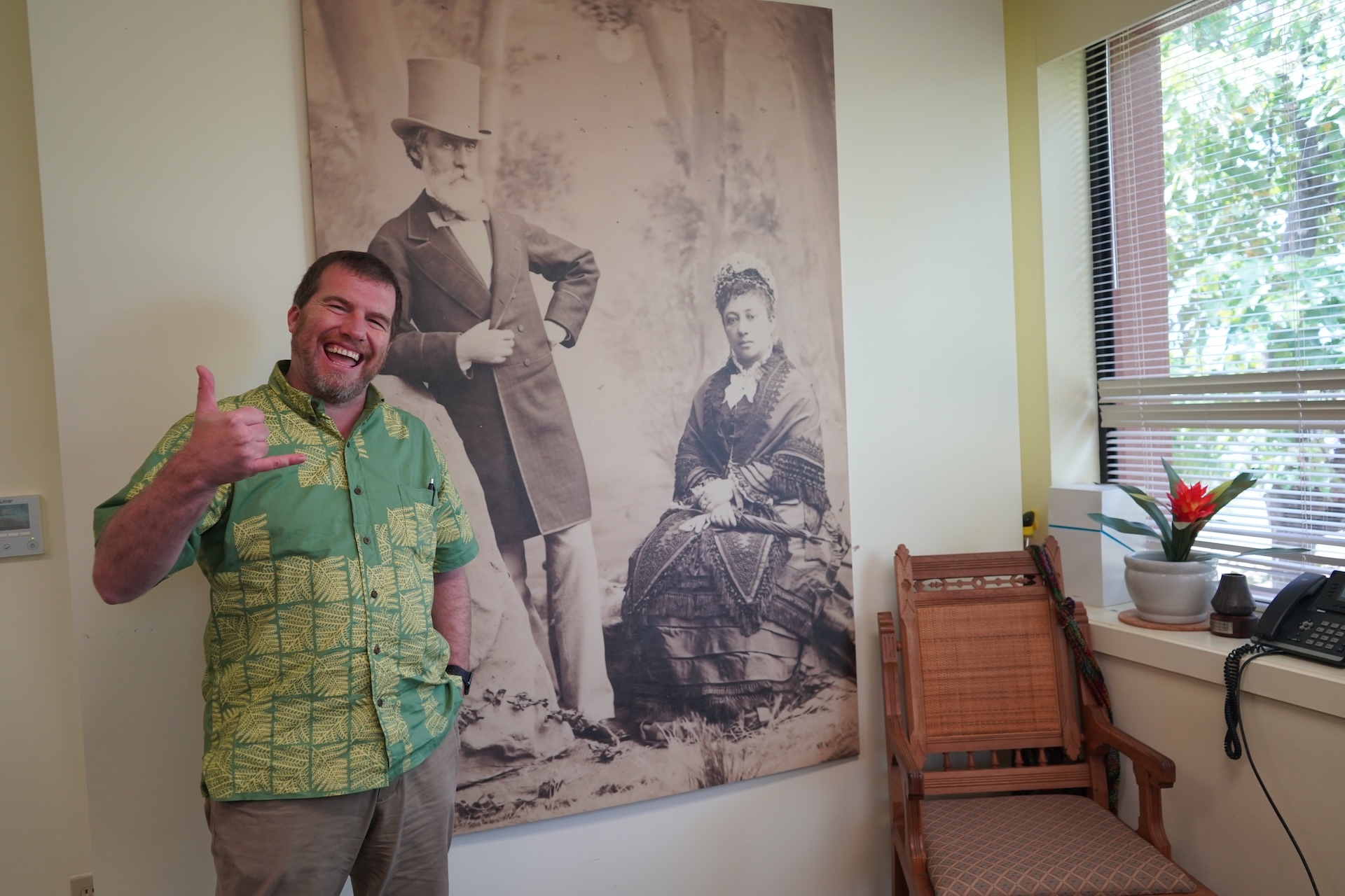 Kris Helgen, president and chief executive officer of the Bishop Museum, stands beside a photo of Bishop Museum’s founder Charles Reed Bishop and his wife, Princess Bernice Pauahi Bishop.