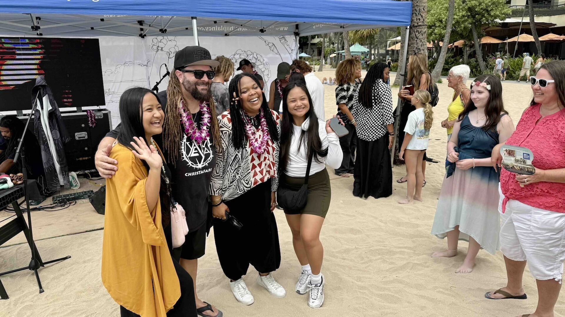 Christafari's Mark Mohr, second from left, pictured with wife Avion, second from right, and a few beachgoers in Waikīkī on Sunday, Sept. 14. The Hawaiian Island Tour: Sounds of Salvation continues this month on Big Island and Kauaʻi.