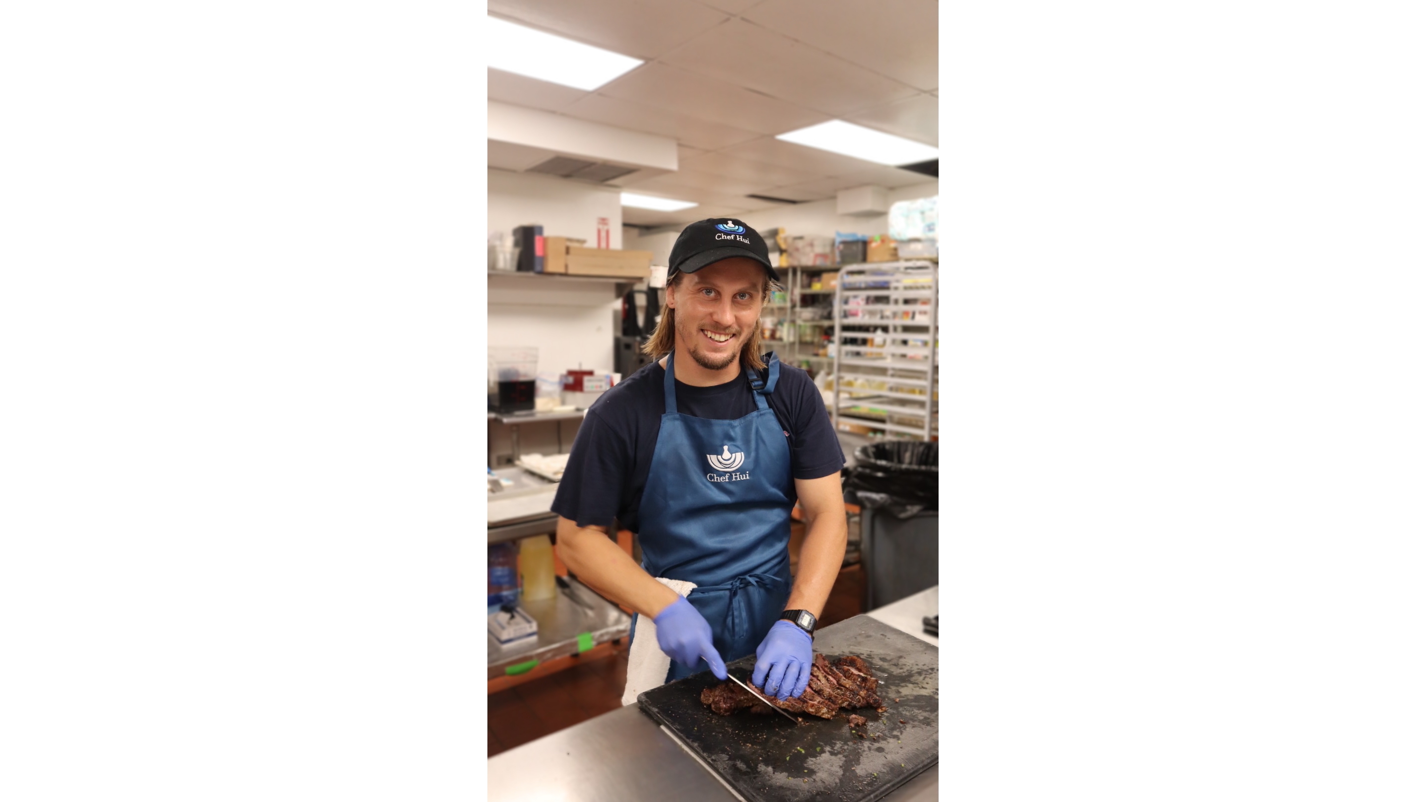 Chef Hui volunteer prepares food for flood victims.