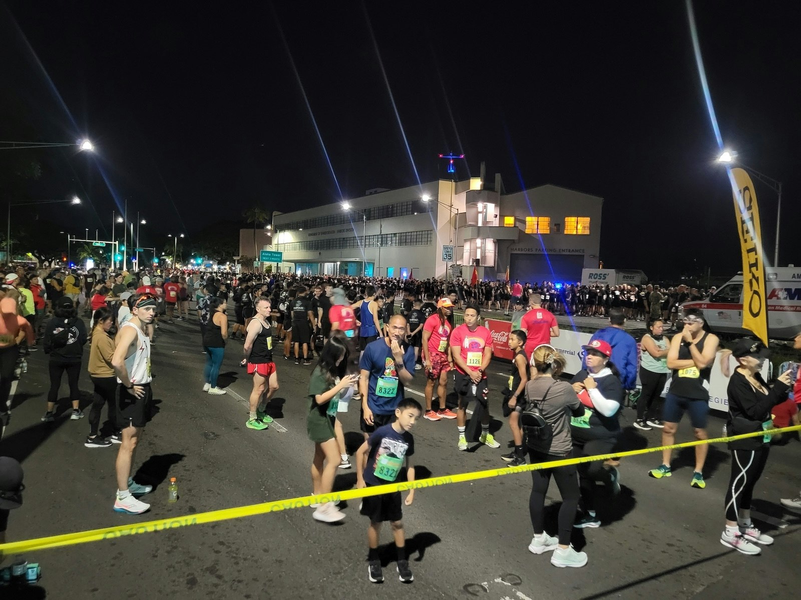 A group of runners in the street early in the morning.