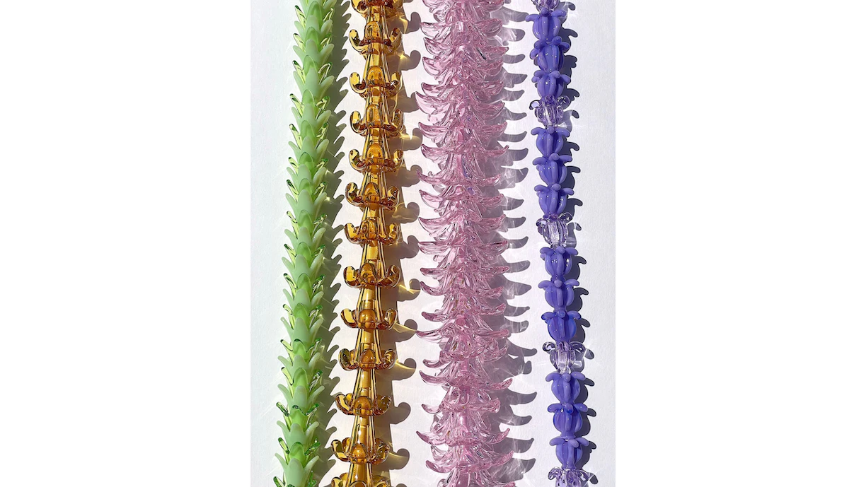 Arlie Pemberton’s glass lei showcase a rainbow of colors and feature pua, such as pakalana, puakenikeni, plumeria and crown flowers.