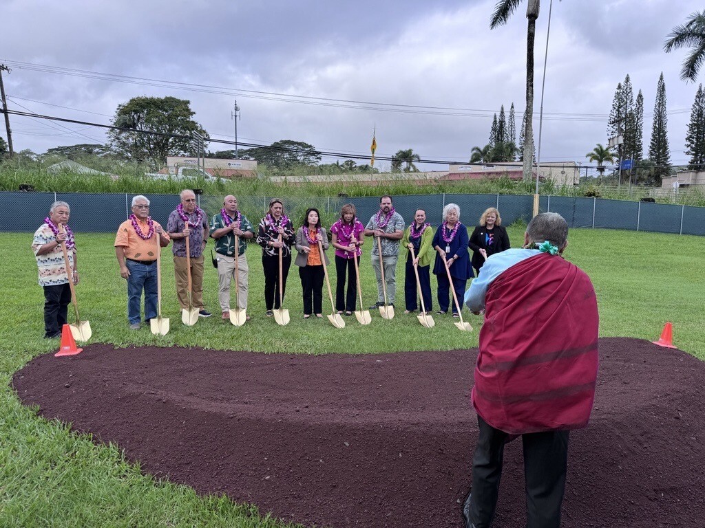 Hawaiʻi County Council member Dennis Onishi, former Rep. Richard Onishi, former Senator Russell Ruderman, Kea‘au Middle School Principal Brandon Tanabe, DOE Complex Area Superintendent Stacey Bello, Lieutenant Governor Sylvia Luke, Sen. Joy San Buenaventura, Rep. Chris Todd, Rep. Jeanne Kapela, BOE member Sylvia Lee, State Librarian Stacey Aldrich, and Cultural Practitioner Kumu Moses Kaho‘okele Crabbe gathered for the groundbreaking of the new library.