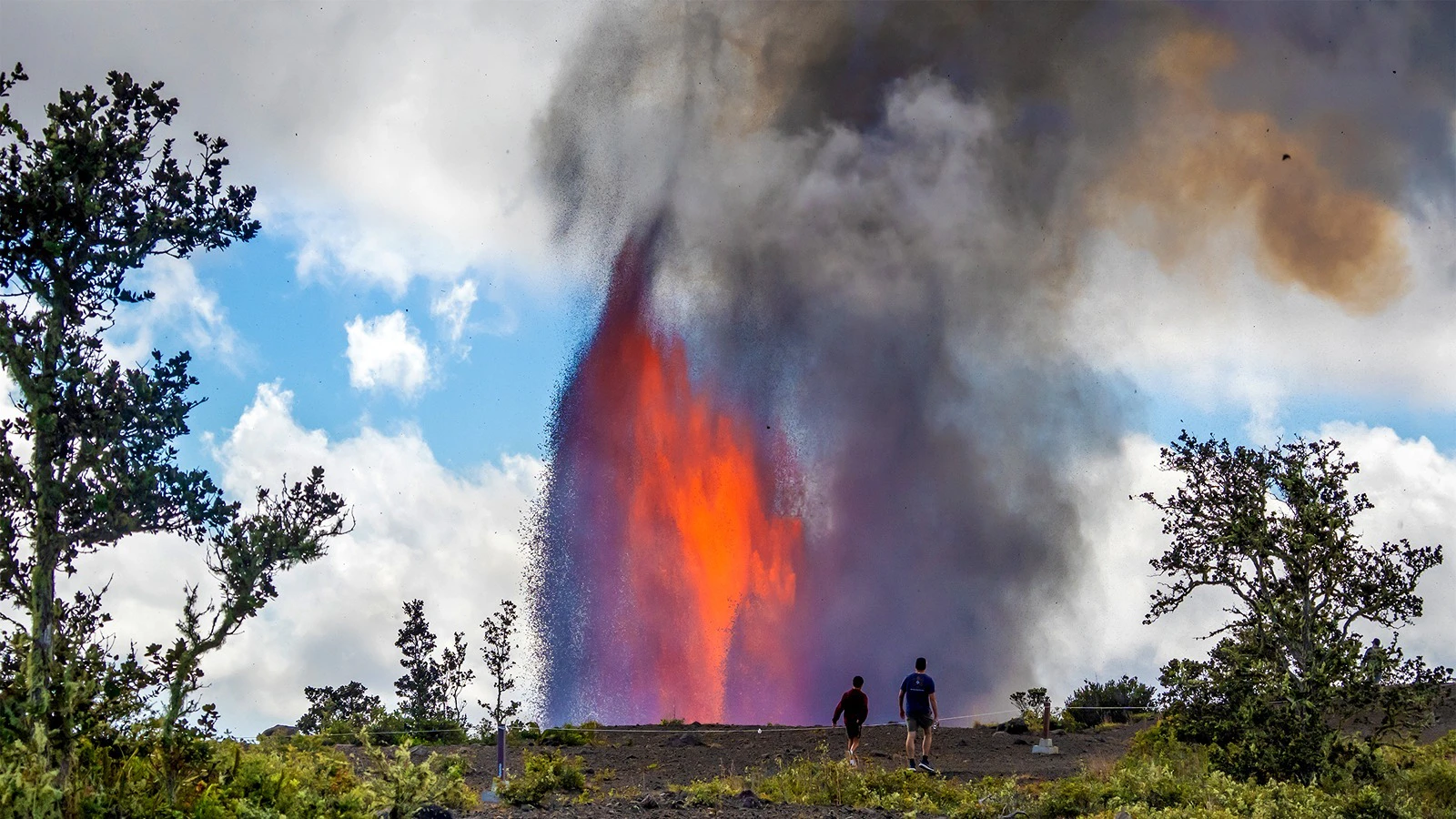 Visitors to Hawaii Volcanoes National Park's Kīlauea Overlook view lava fountains during Episode 41 of Kīlauea volcano's ongoing eruption, Jan. 24.