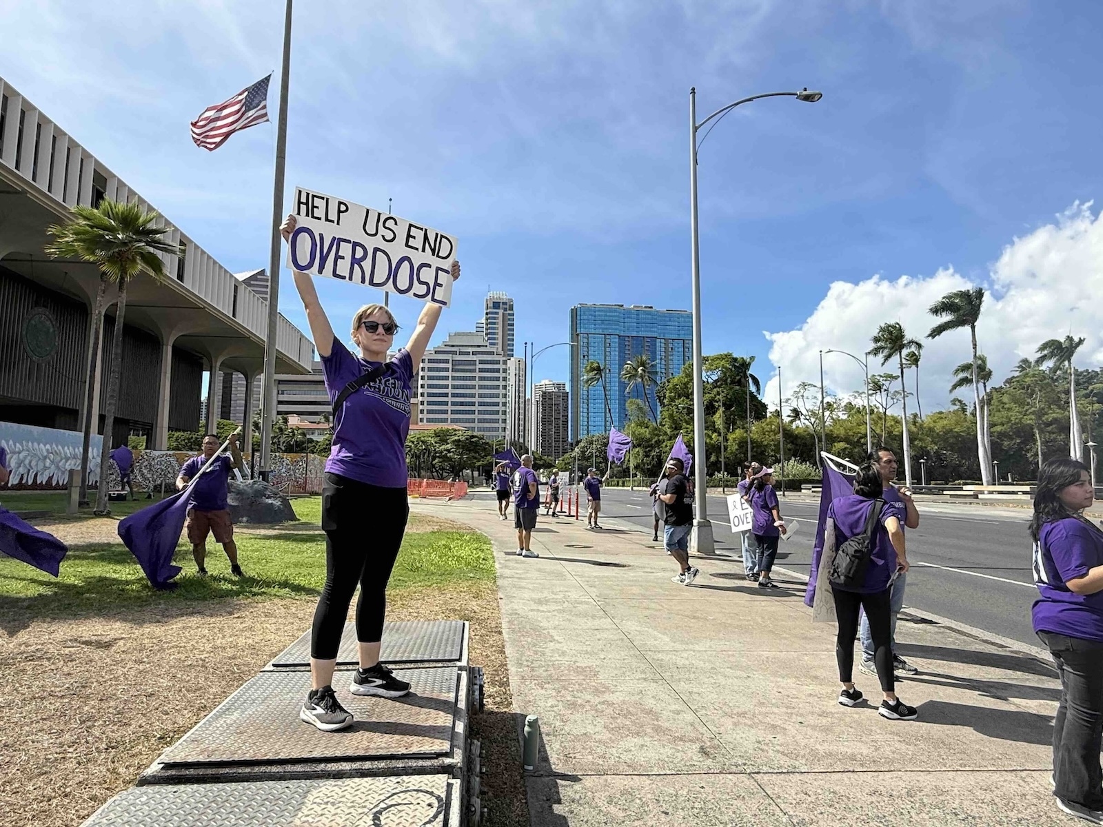 People dressed in purple filled the sidewalk along S. Beretania Street Friday afternoon, in front of the Hawaiʻi State Capitol