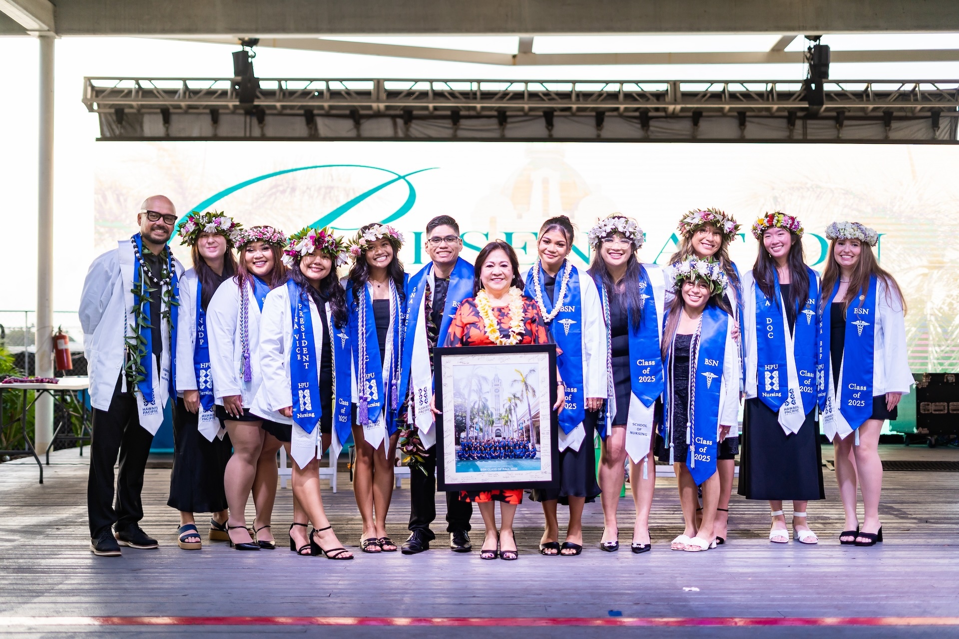 Hawaiʻi Pacific University Bachelor of Science in Nursing students pictured with  Dean of BSN School Edna Magpantay-Monroe, center, at graduation in December 2025.