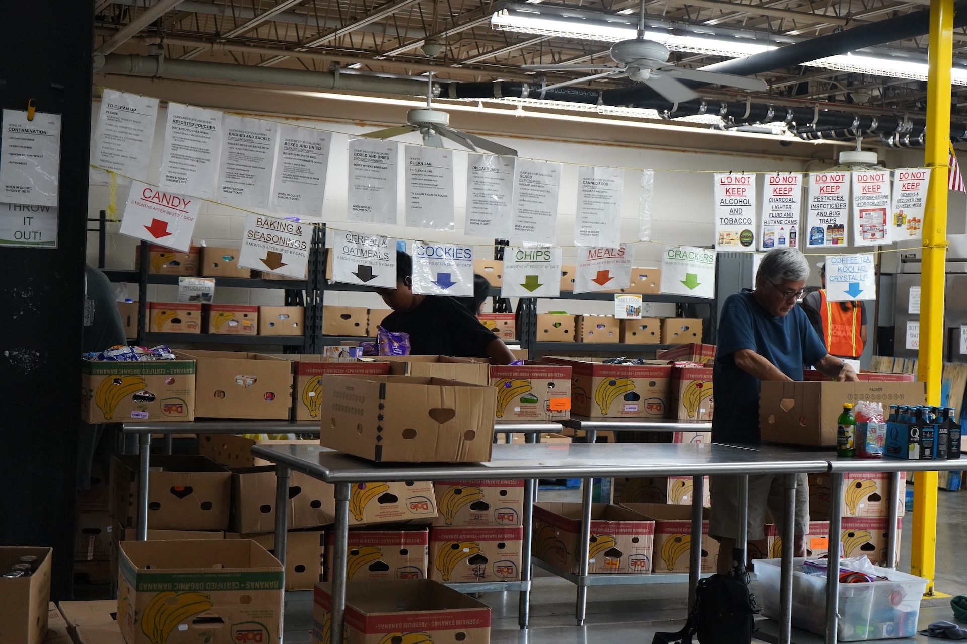 Becoming a volunteer, donating monetarily and spreading the word are some of the ways to get involved or give back to the Hawaiʻi Foodbank. Pictured here are volunteers sorting food donations. Sign up to help online. Photos by Kelsey Kukaua Medeiros.