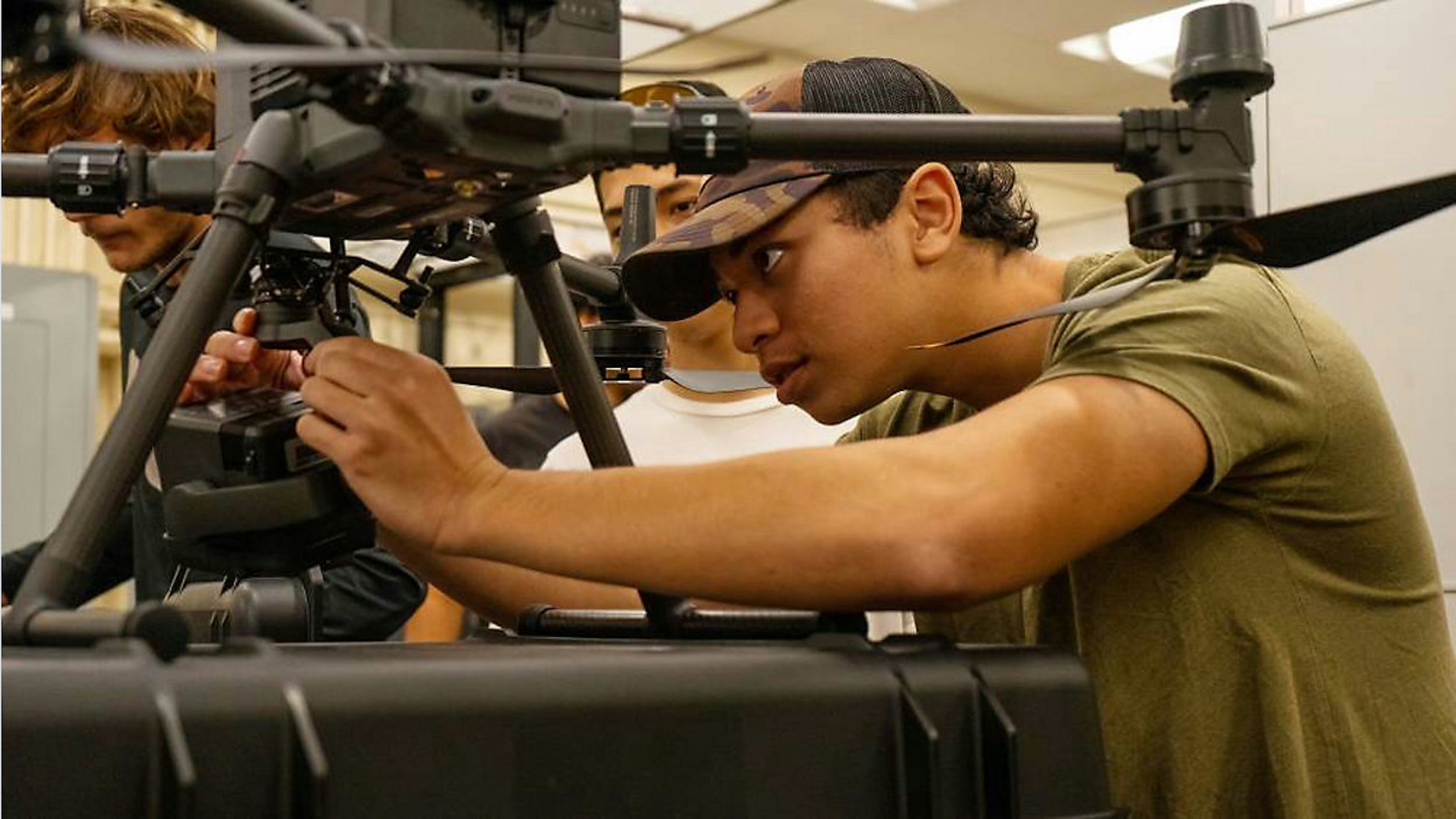 Thomas Costa sets up 350 RTK drone for flight.