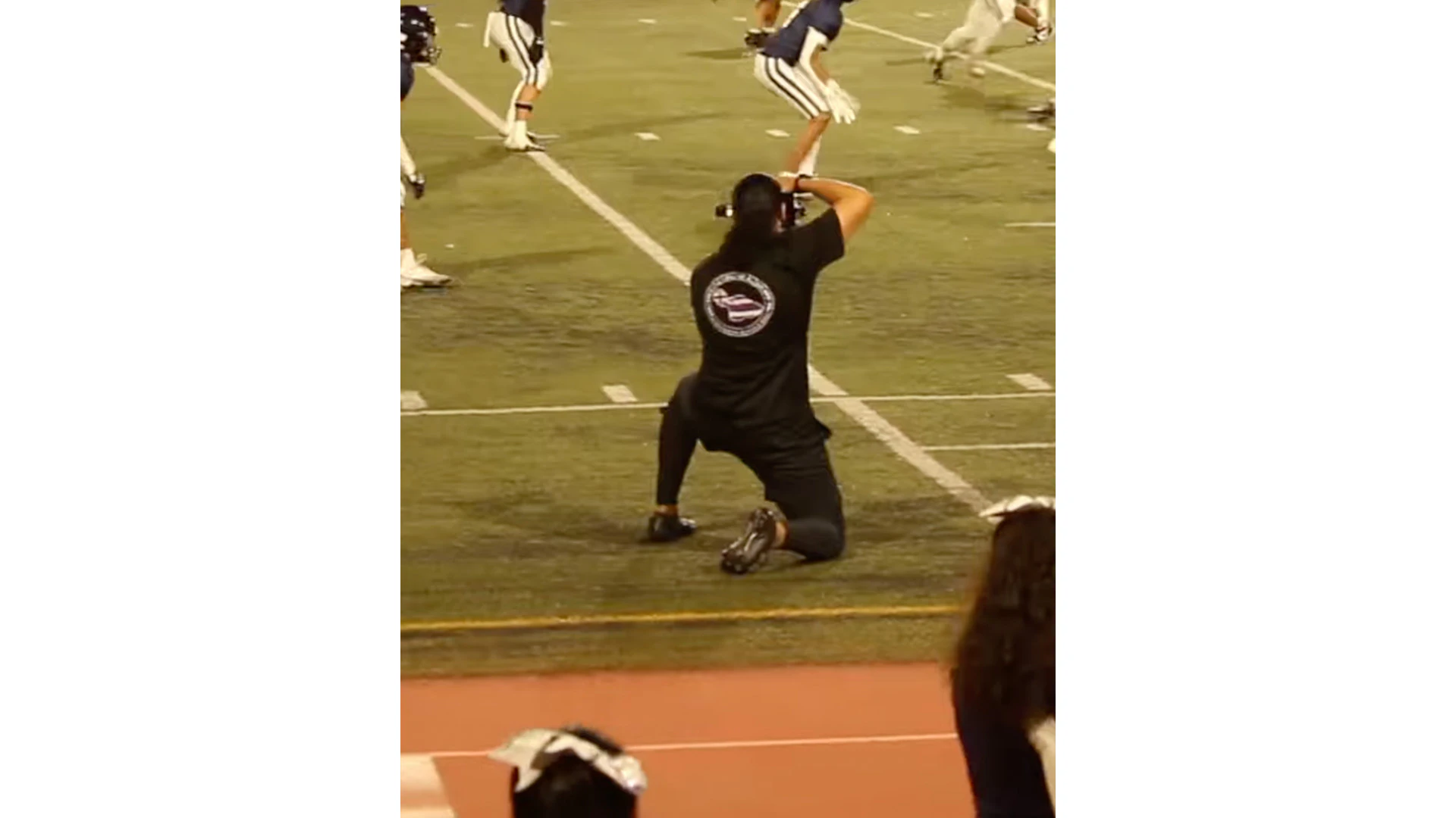 Hezekiah_Kapuaala capturing a football game