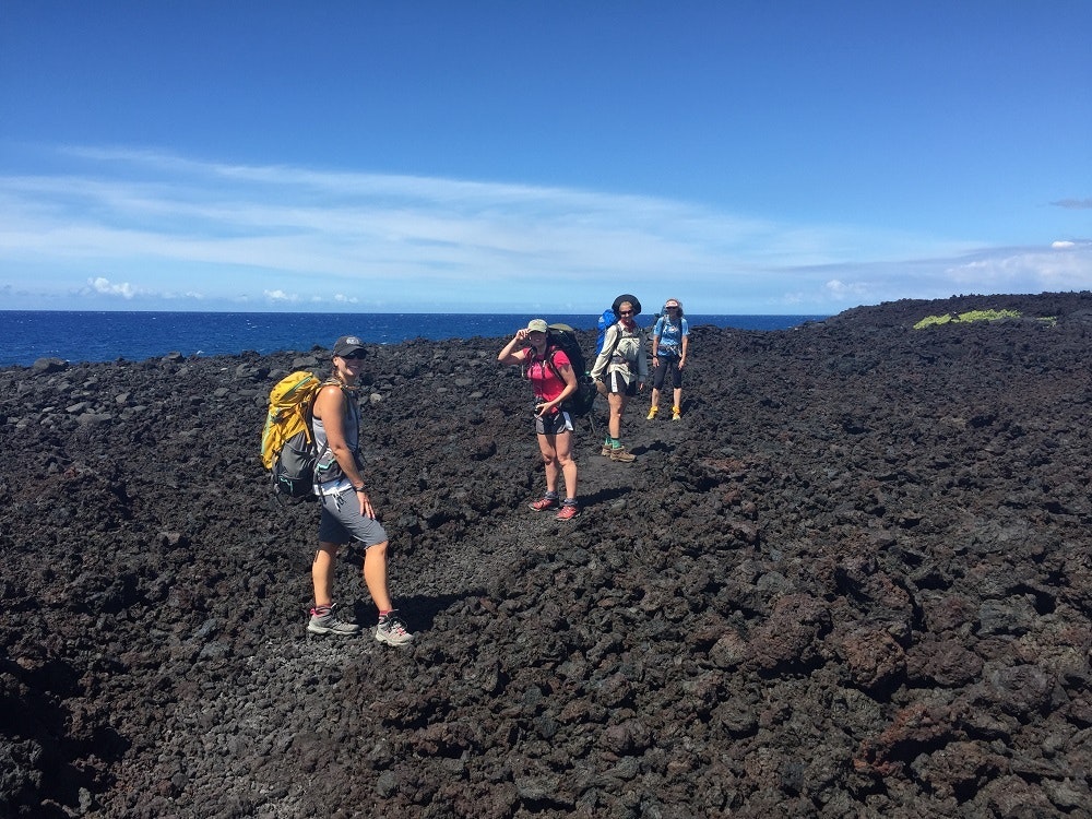 Hikers on the Puna Coast Trail in Hawai‘i Volcanoes National Park.