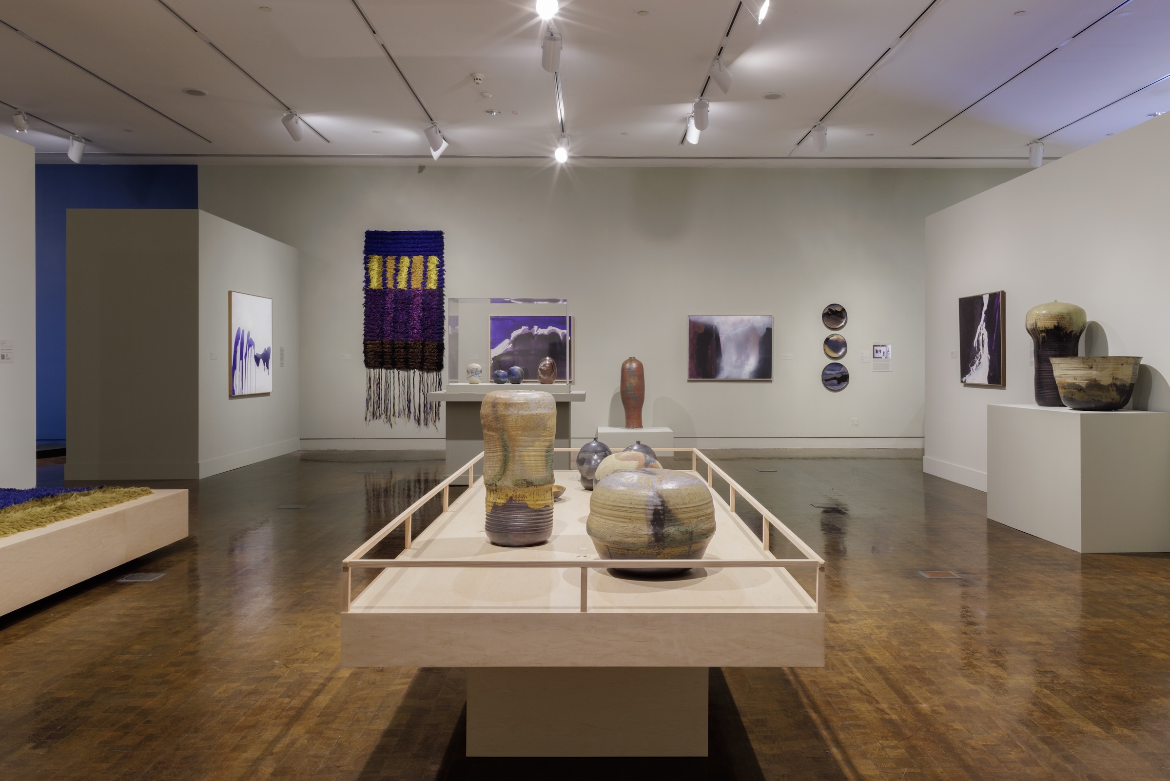 Toshiko Takaezu also created artwork from textiles, as displayed top left.