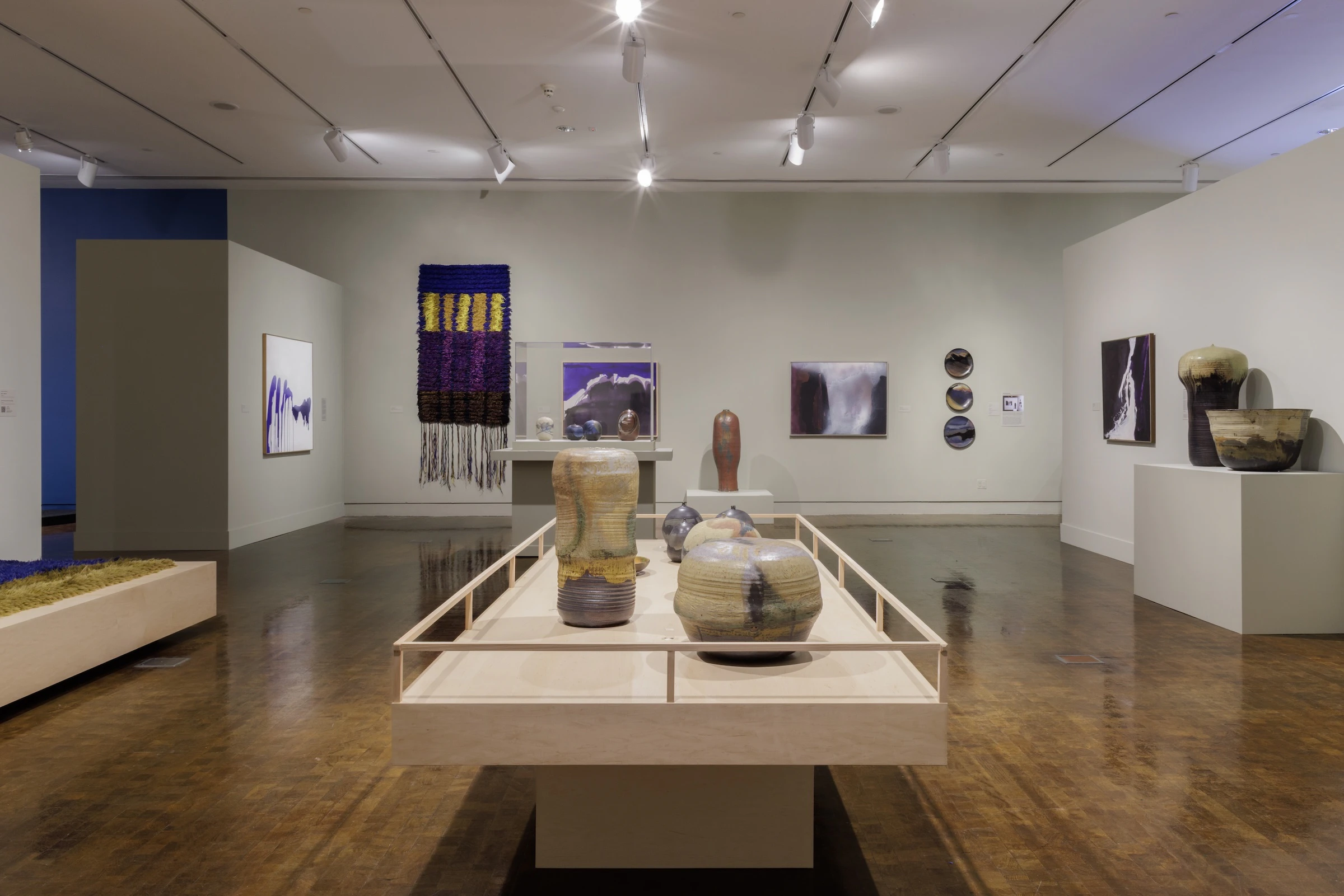 Toshiko Takaezu also created artwork from textiles, as displayed top left.