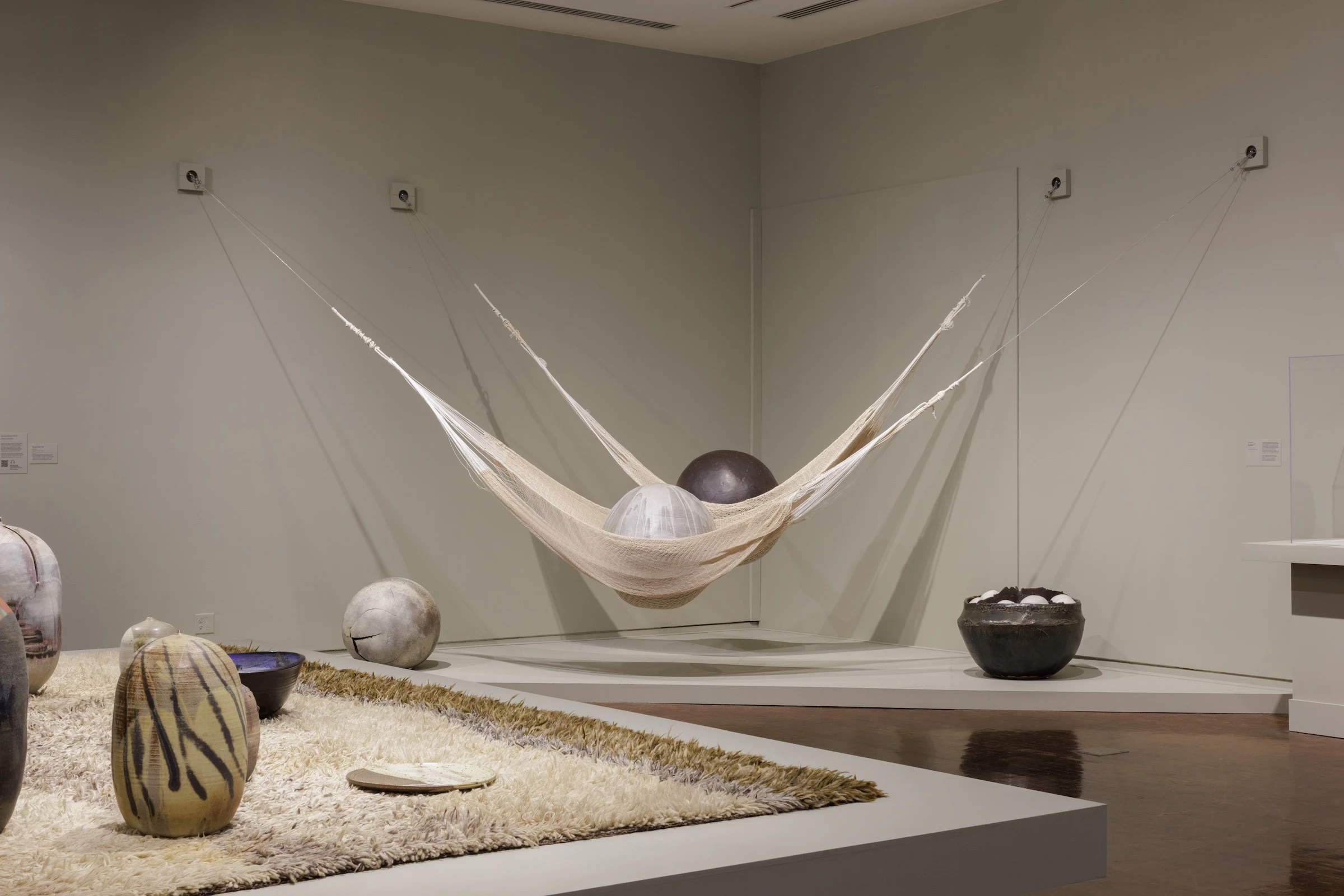Toshiko Takaezu used nets to hold some of her drying pieces, but later decided this was a way to display her art.