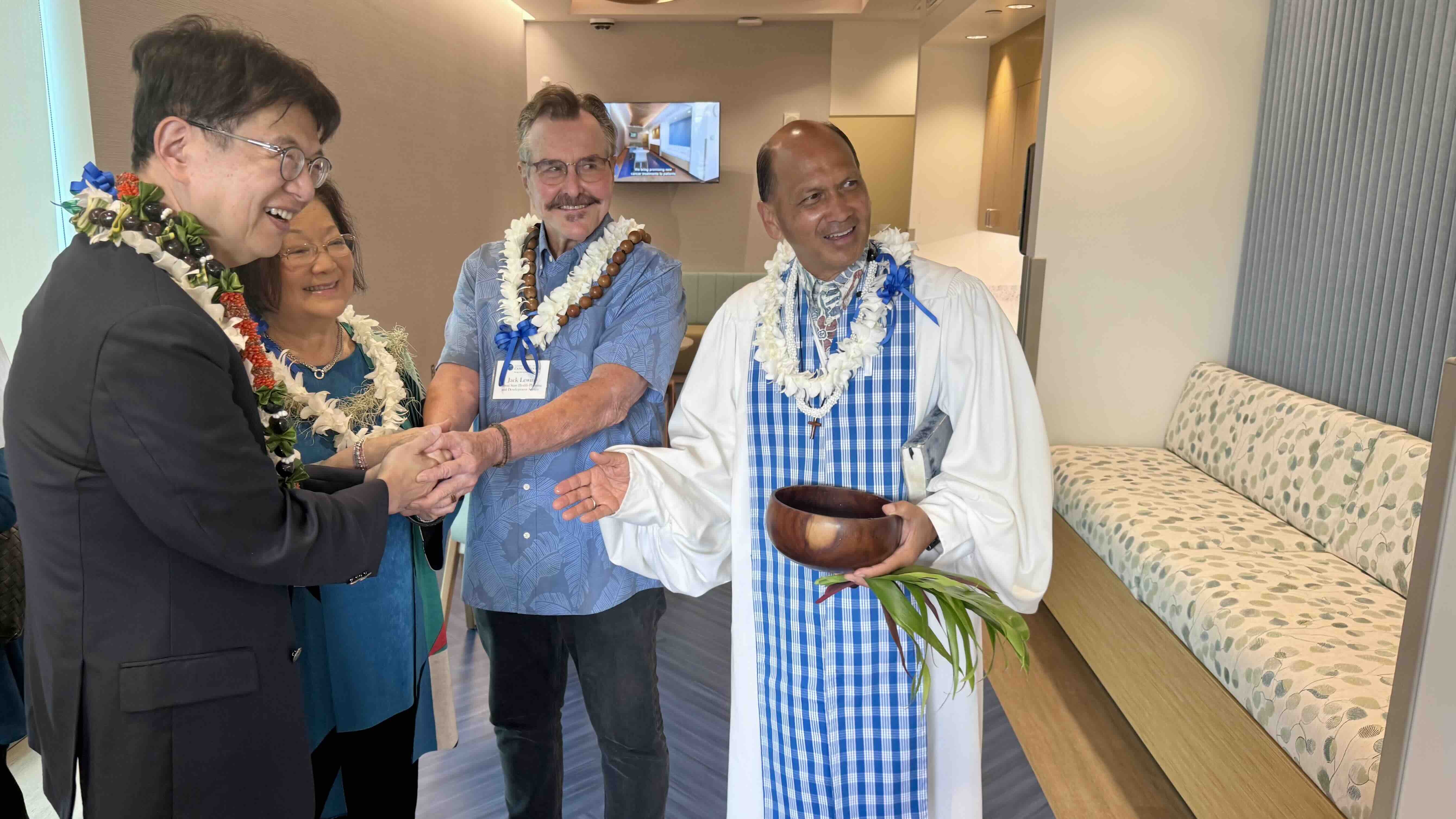 Pictured from left: Dr. Naoto Ueno, UH Cancer Center Director; Sen. Mazie Hirono; Dr. Jack Lewin, Administrator of the Hawaiʻi State Health Planning and Development Agency; and Kahu Kordell Kekoa bless the new Hoʻōla Early Phase Clinical Research Center on Monday, July 6, 2026. Photo by Kelsey Kukaua Medeiros.