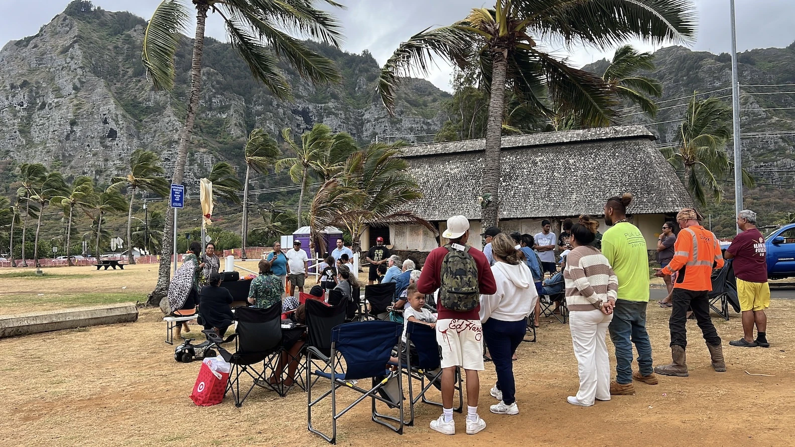 A crowd gathered for a ceremony that unveiled a sign with the beach park campground's new name.