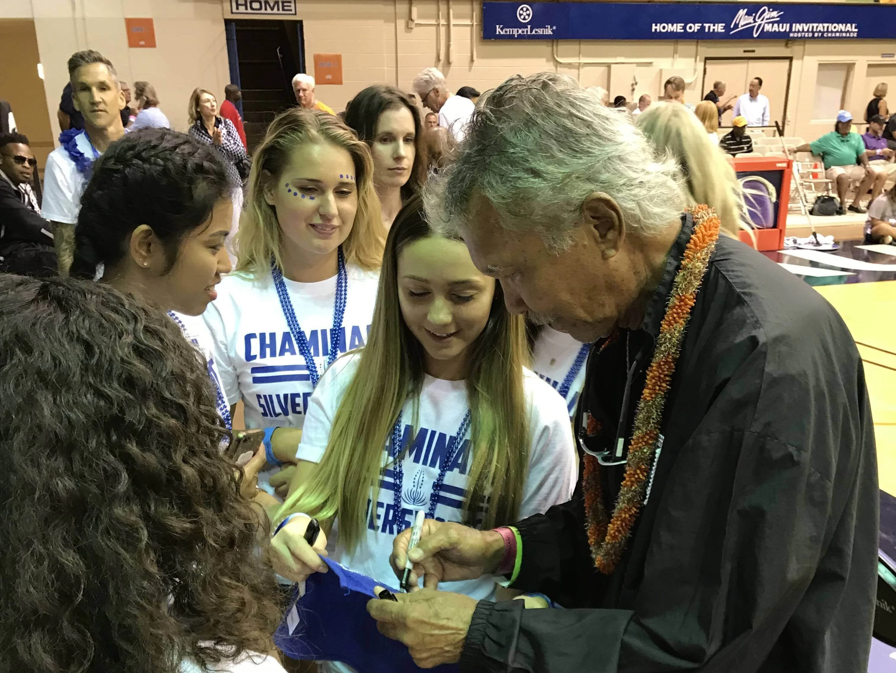 Merv Lopes with Chaminade University athletes.