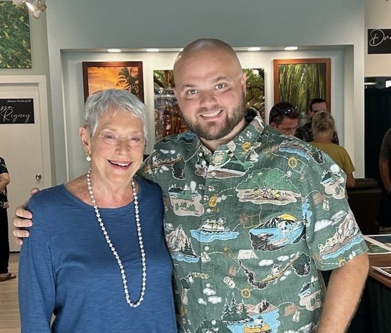 Charlene Walker, the store’s previous owner, and Chris Anderson, its current owner, at the grand opening of Lahaina Printsellers at its new location at Lahaina Cannery.