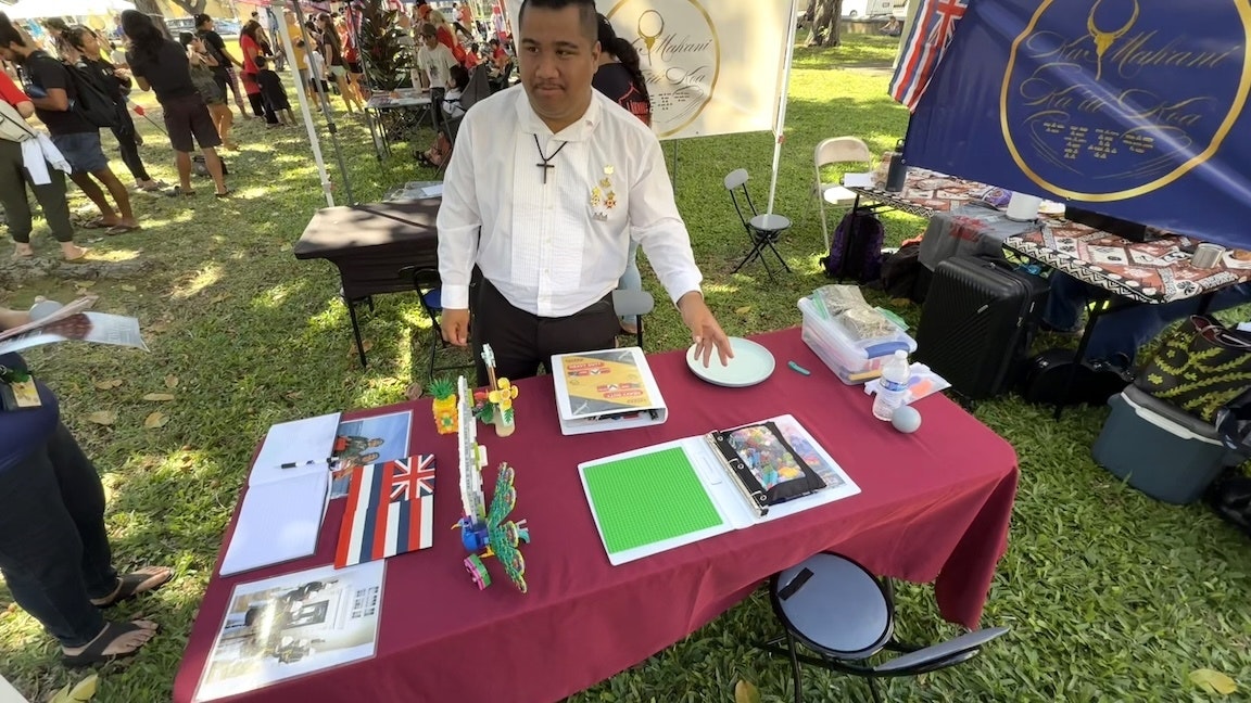 A man pictured at an educational booth.