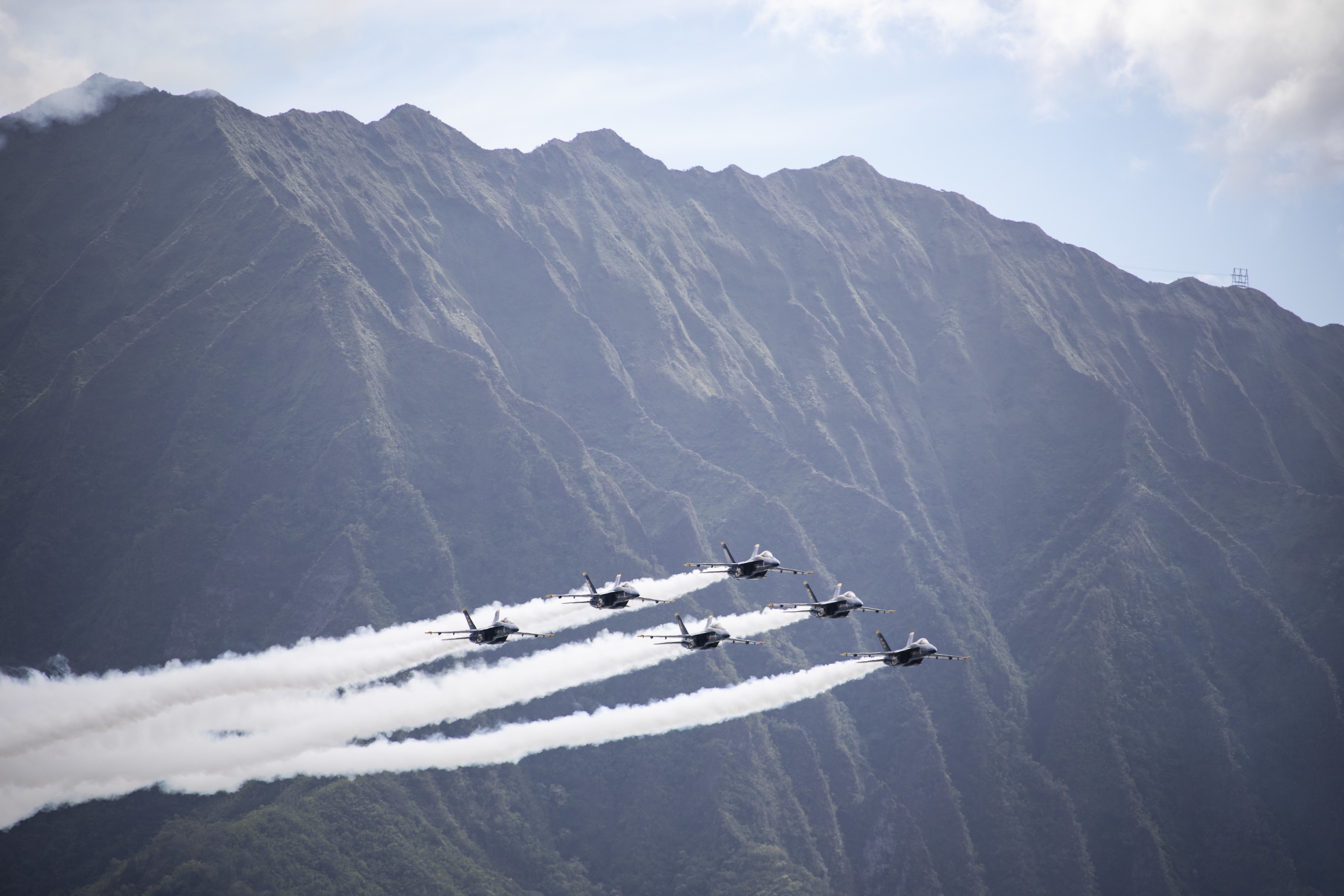 The Kāneʻohe Bay Air Show features a variety of performances, including one from the U.S. Navy Blue Angels.