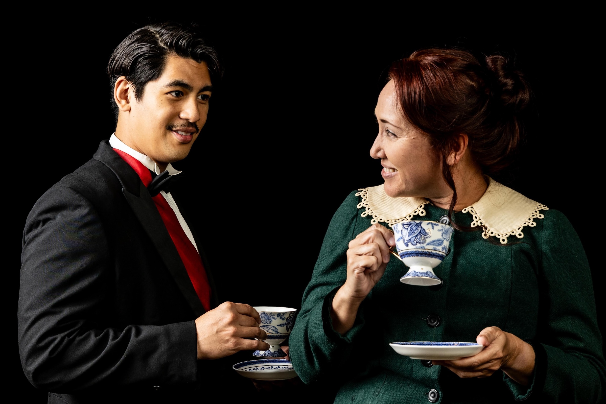King Lunalilo, left, is played by Kaipo Dudoit, while Isabella Bird, right, is played by Julia Avilla LoPresti in “Outlandish,” now showing at Kumu Kahua Theatre.