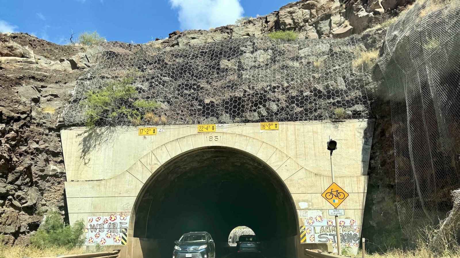 "We're Lahaina Strong" painted on tunnel enroute to Lahaina.