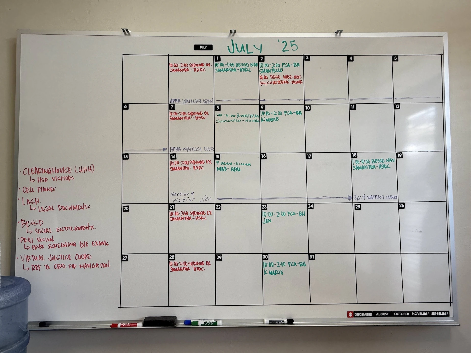 This whiteboard inside Malu Kou displays July's schedule of important events and when providers will be available at the center.