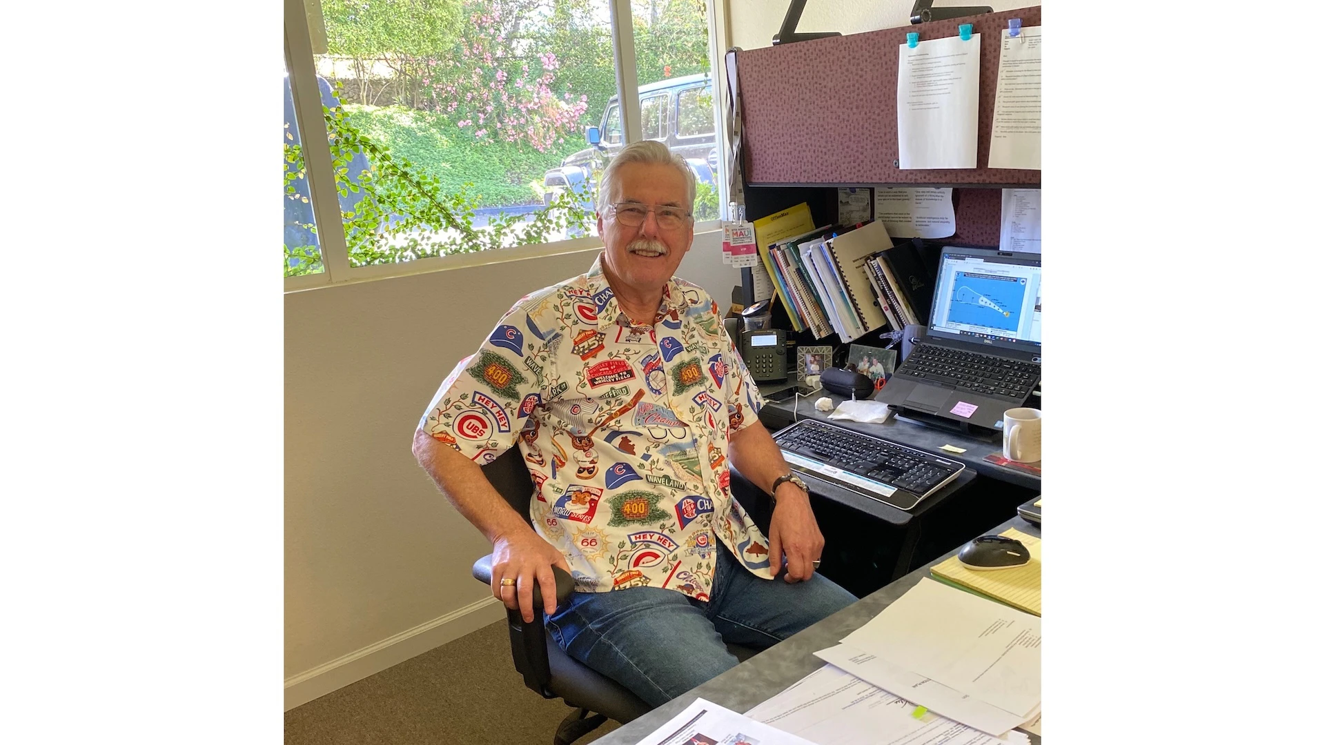 Frank "Bud" Pikrone is the outgoing general manager of The Wailea Community Association. Originally from The Windy City, he is pictured at his desk in Chicago Cubs alohawear.