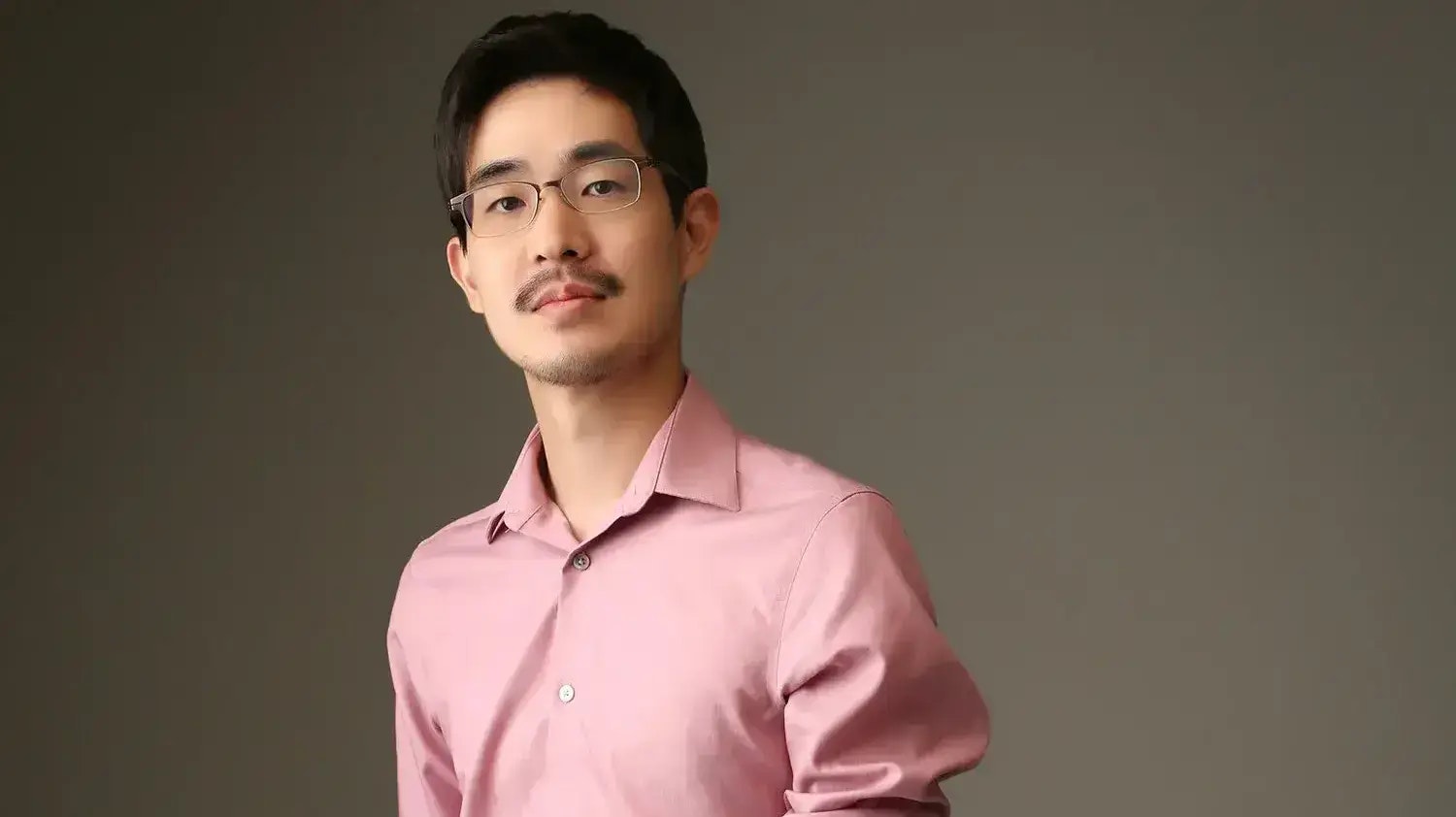 Michael Lim, shown here, has played violin at side-by-side concerts as a student and a professional musician.