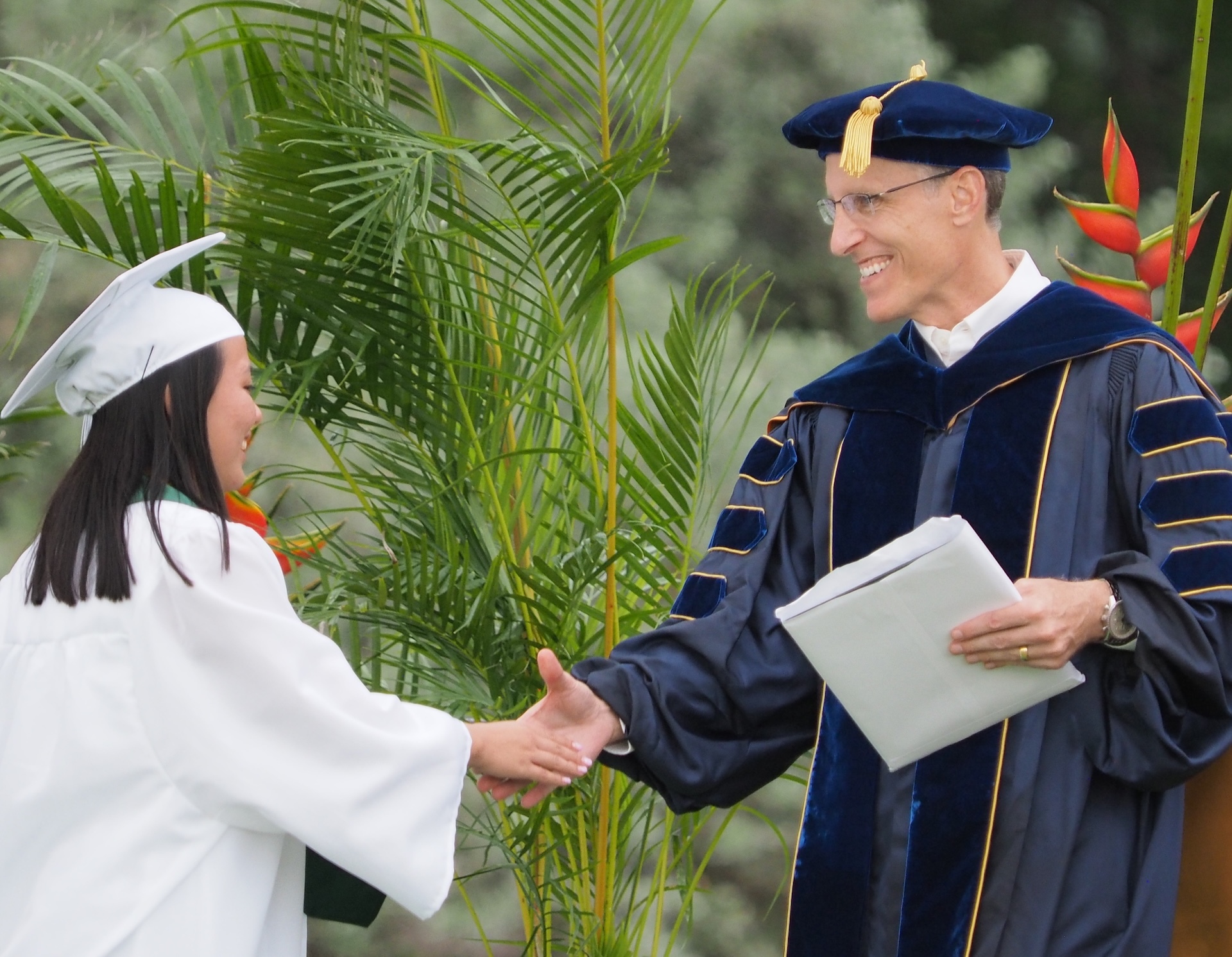 OLYMPUS DIGITAL CAMERA
President Paul Turnbull shares a congratulatory moment with a graduate during Commencement.