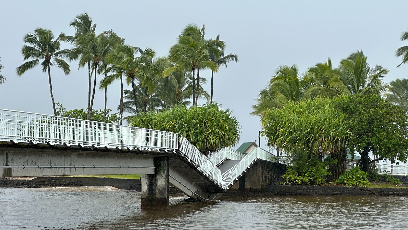 A portion of a footbridge connecting Moku‘ola, or Coconut Island, to the Hilo shoreline collapsed Friday.