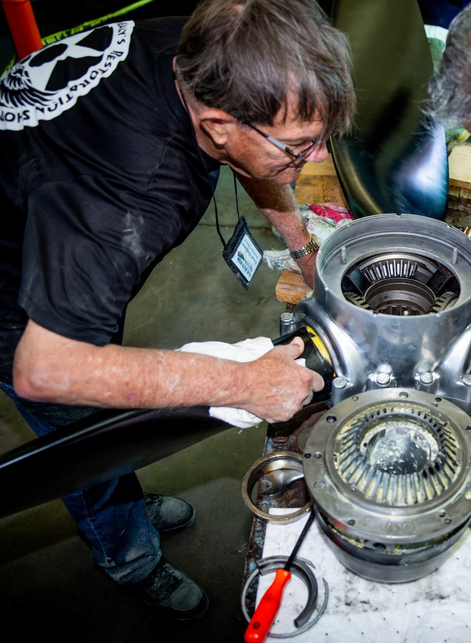 Montgomery works on the propeller hub assembly of a TBM Avenger, a World War II-era torpedo bomber. Credit: PHAM.