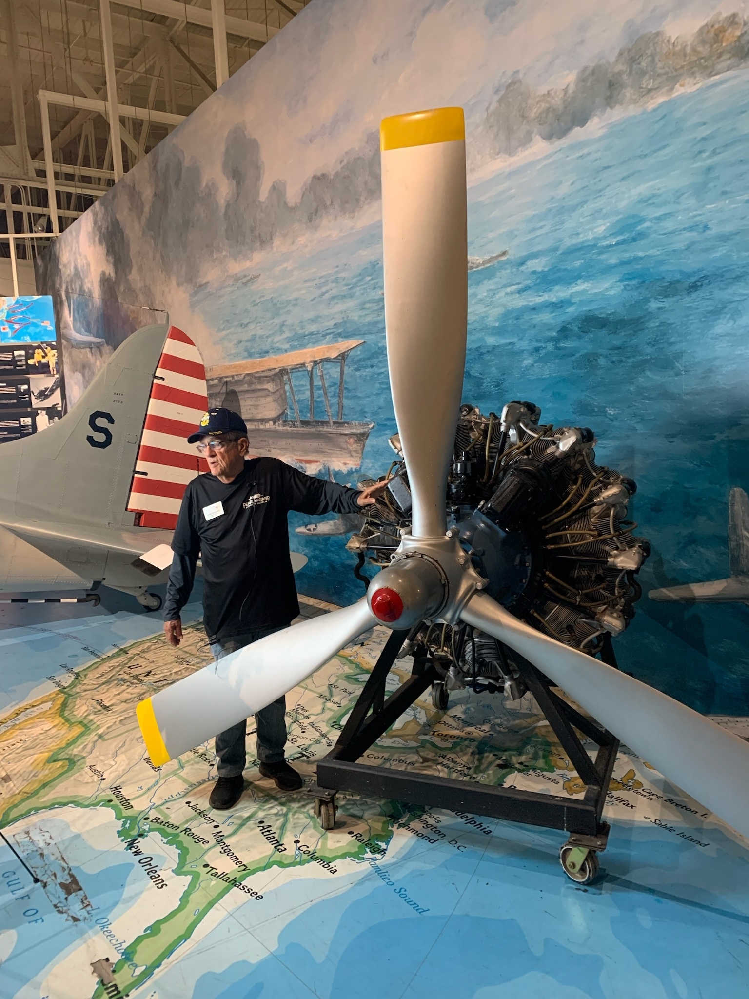 Montgomery displays a Pratt & Whitney R-2000 radial engine, which was developed in 1942 to power a variety of U.S. military aircraft. Credit: PHAM.