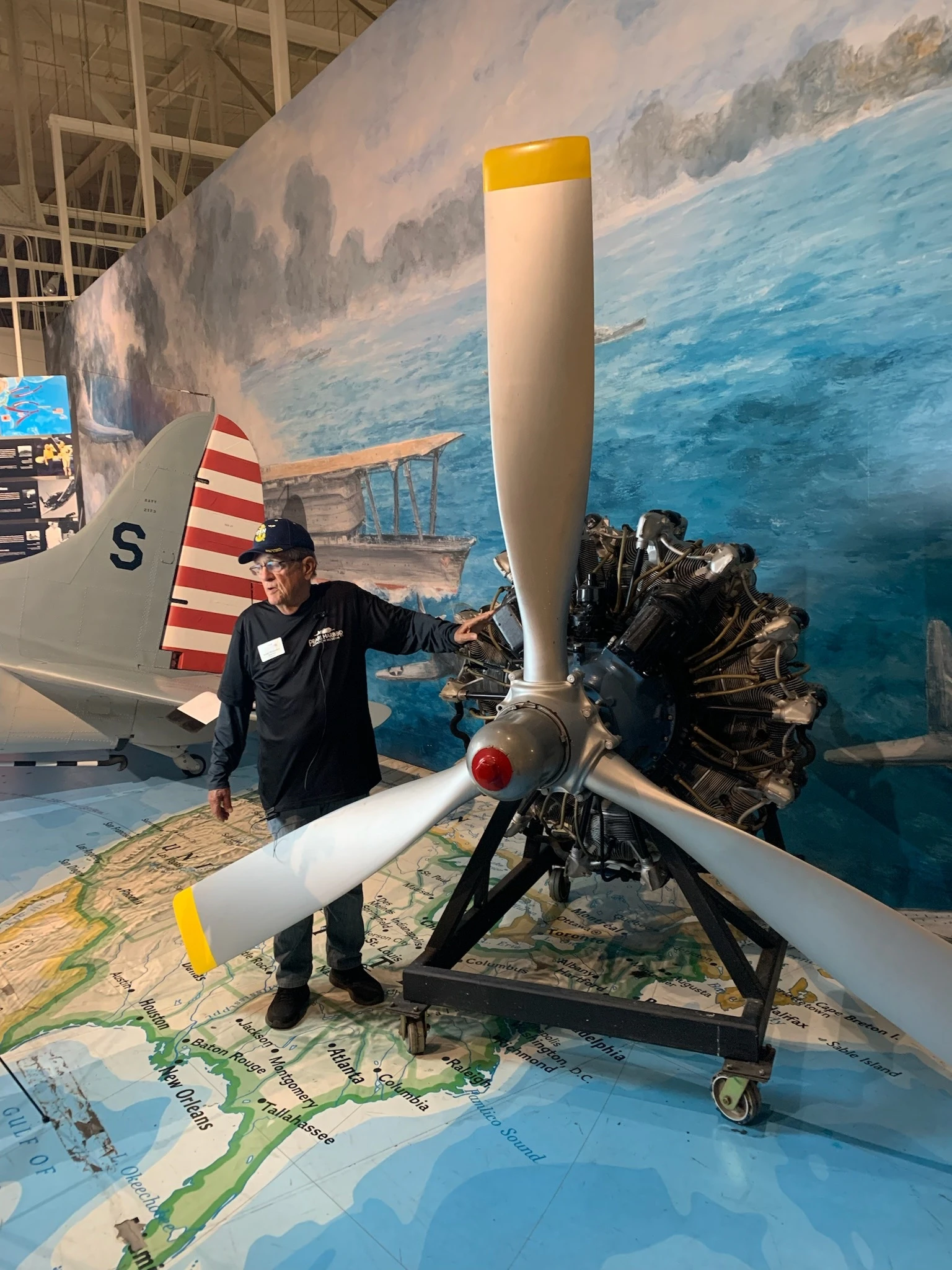 Montgomery displays a Pratt & Whitney R-2000 radial engine, which was developed in 1942 to power a variety of U.S. military aircraft. Credit: PHAM.